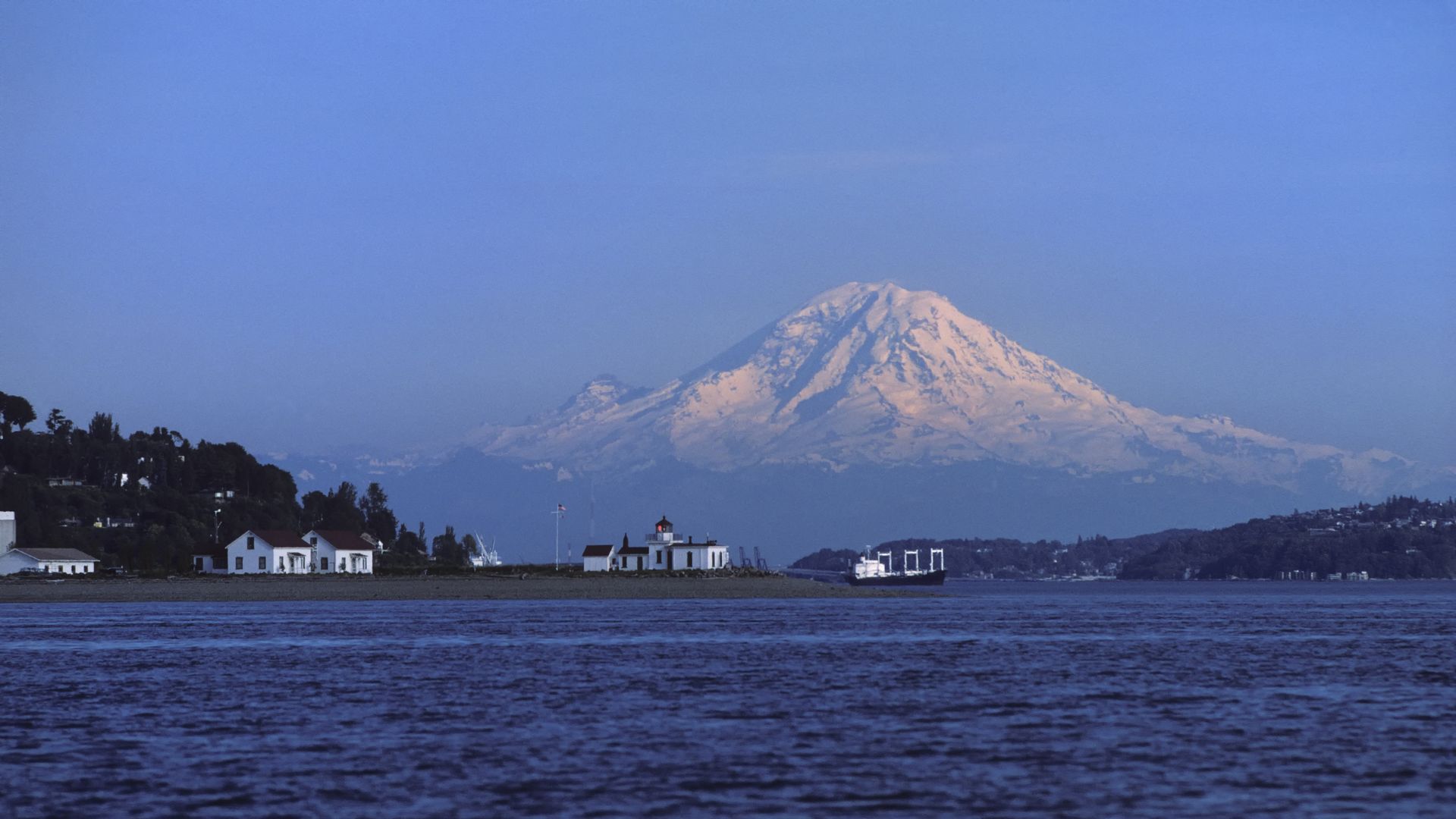 A stretch of Puget Sound's blue water in front of Rainier in the distance. 