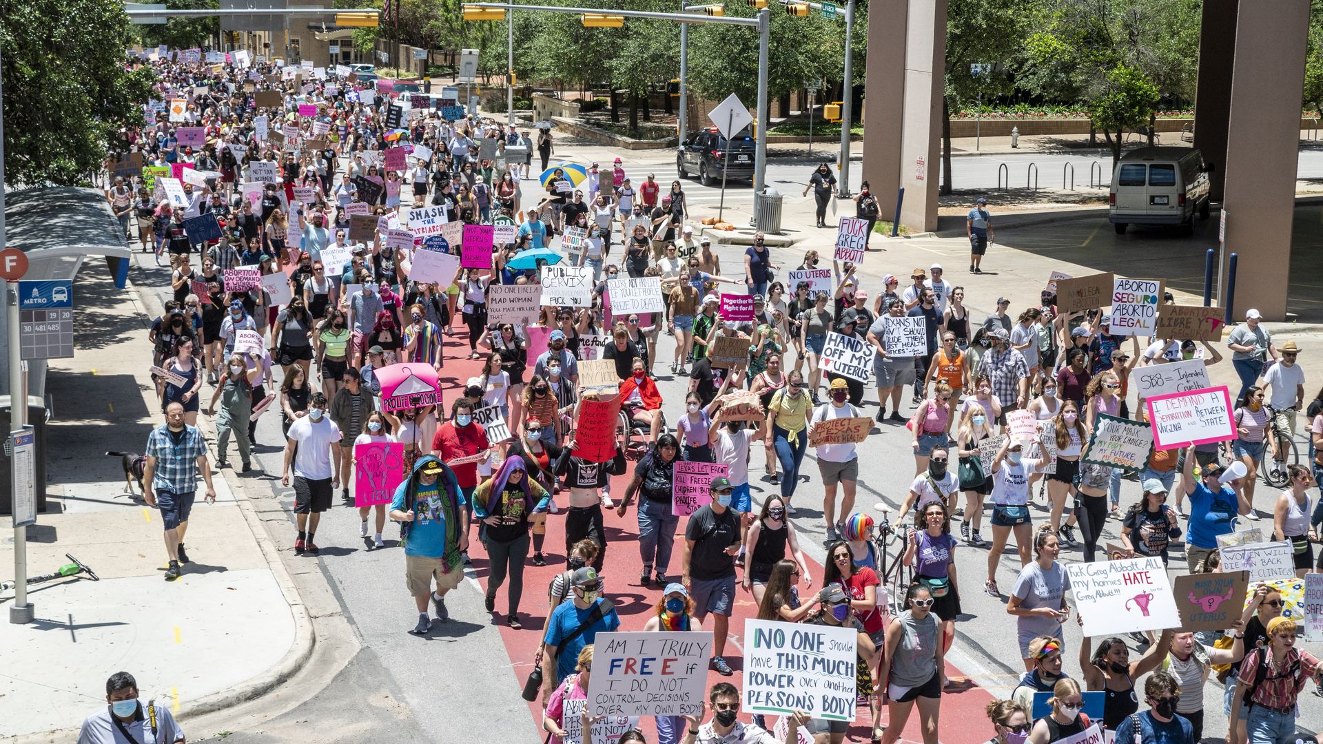 Protesters march down Lavaca Street at a protest outside the Texas state capitol on May 29, 2021 in Austin, Texa