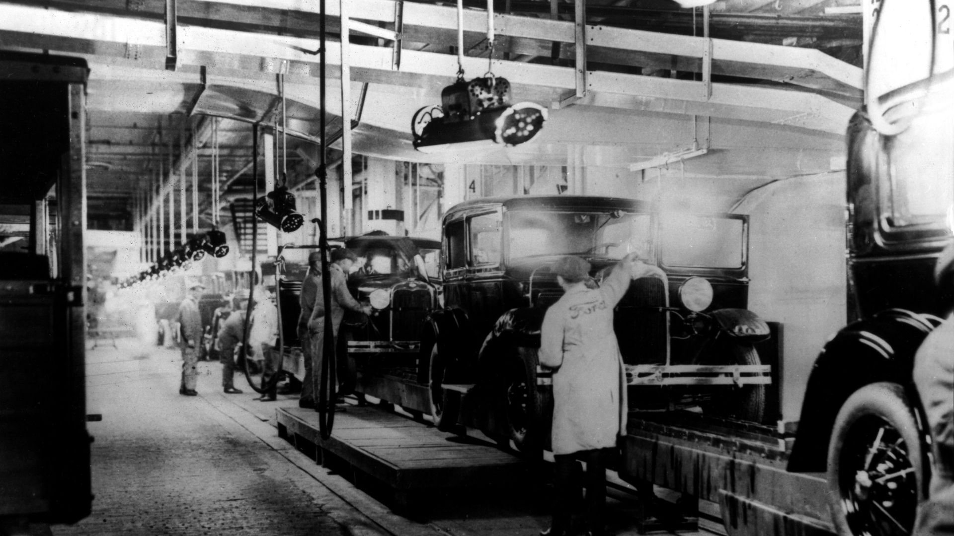 An old photo of a car factory assembly line
