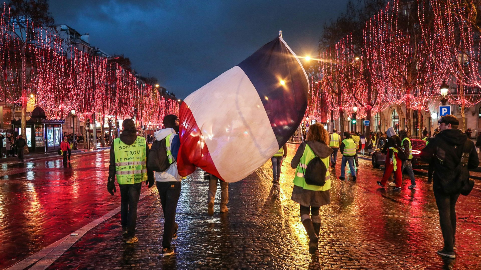 Yellow vest protestors carry French flag