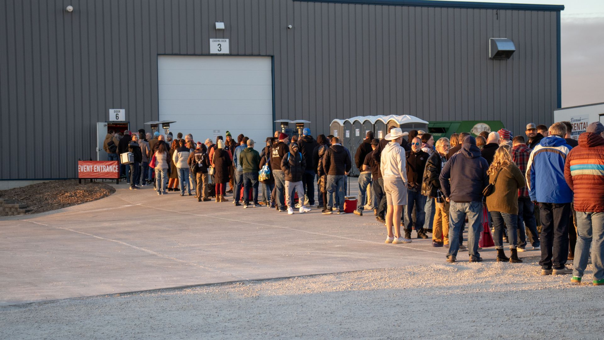 a crowd of people waiting for a beer release