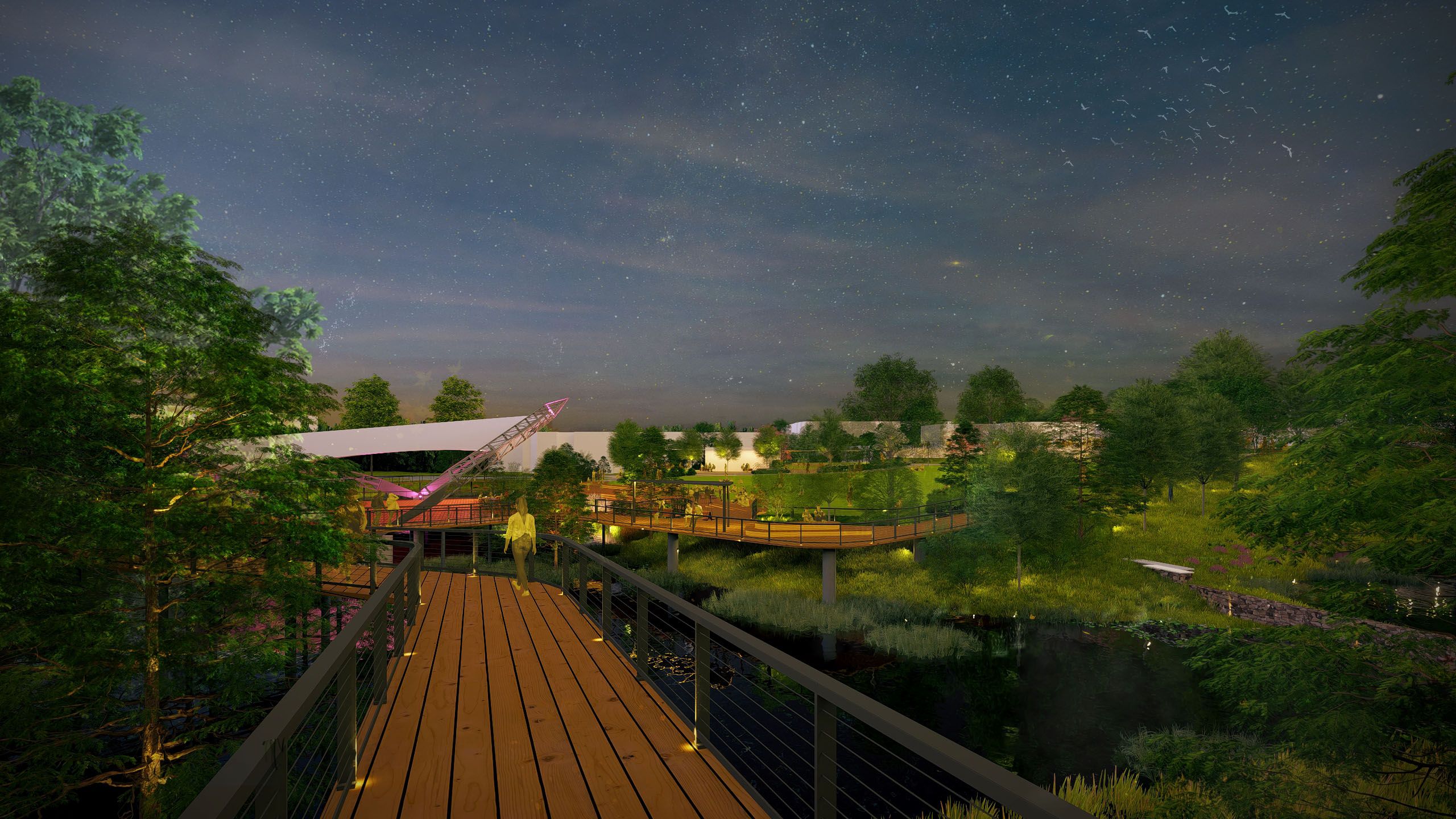Nighttime view of a wooden boardwalk over water surrounded by green trees and illuminated paths, with people walking and relaxing under a starry sky.