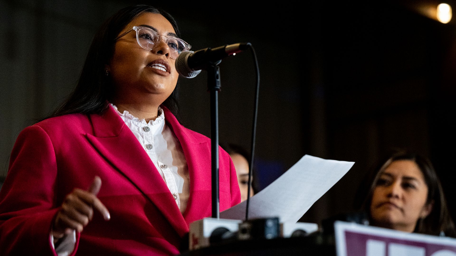 Democratic candidate for the U.S. House, Jessica Cisneros, speaks in front of a microphone in Laredo, Texas