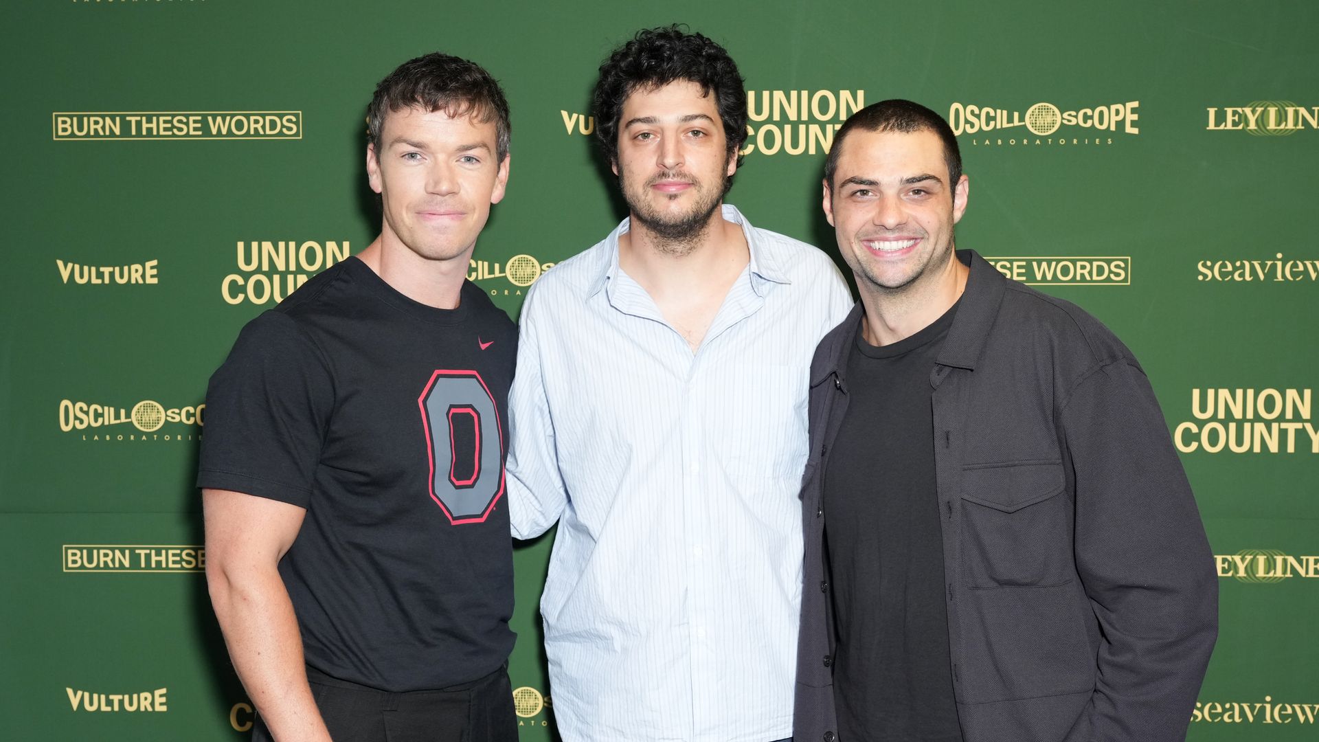Three white men in front of a green board promoting "Union County" film.