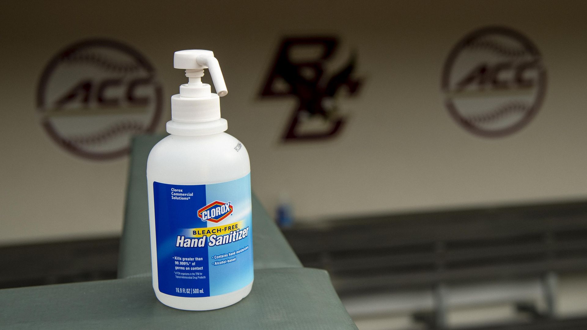 A bottle of hand sanitizer in front of Boston College's baseball dugout