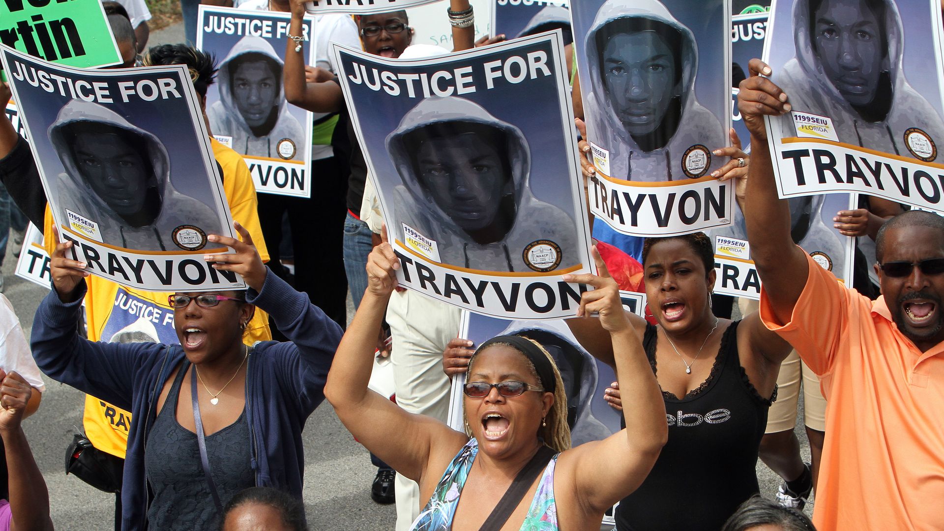 Thousands of demonstrators march along W. 13th Street in Sanford, Florida, during a NAACP rally and march demanding for justice in the shooting of Trayvon Martin, Saturday, March 31, 2012. 