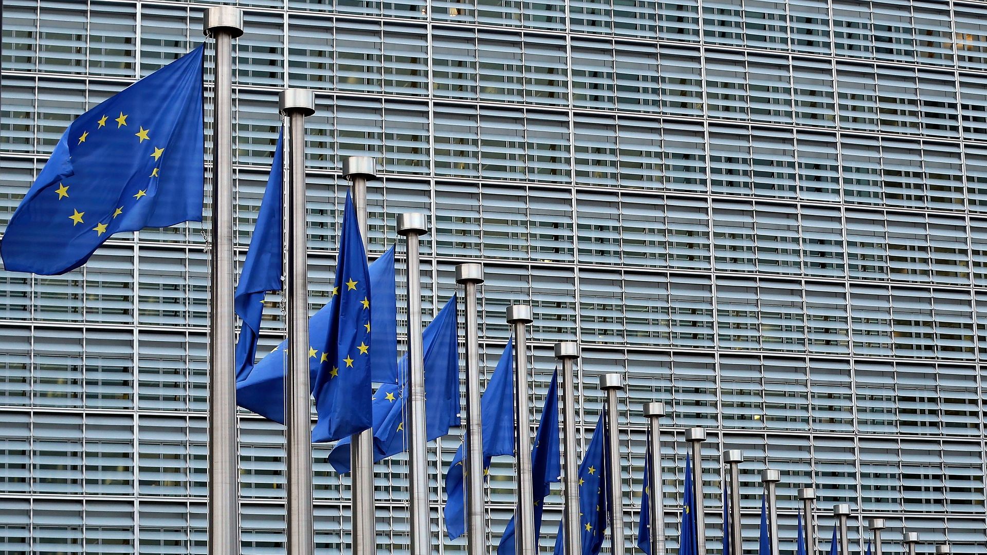 The European Commission building with European Union flags waving in front in Brussels, Belgium. (Photo by Dursun Aydemir/Anadolu Agency/Getty Images)