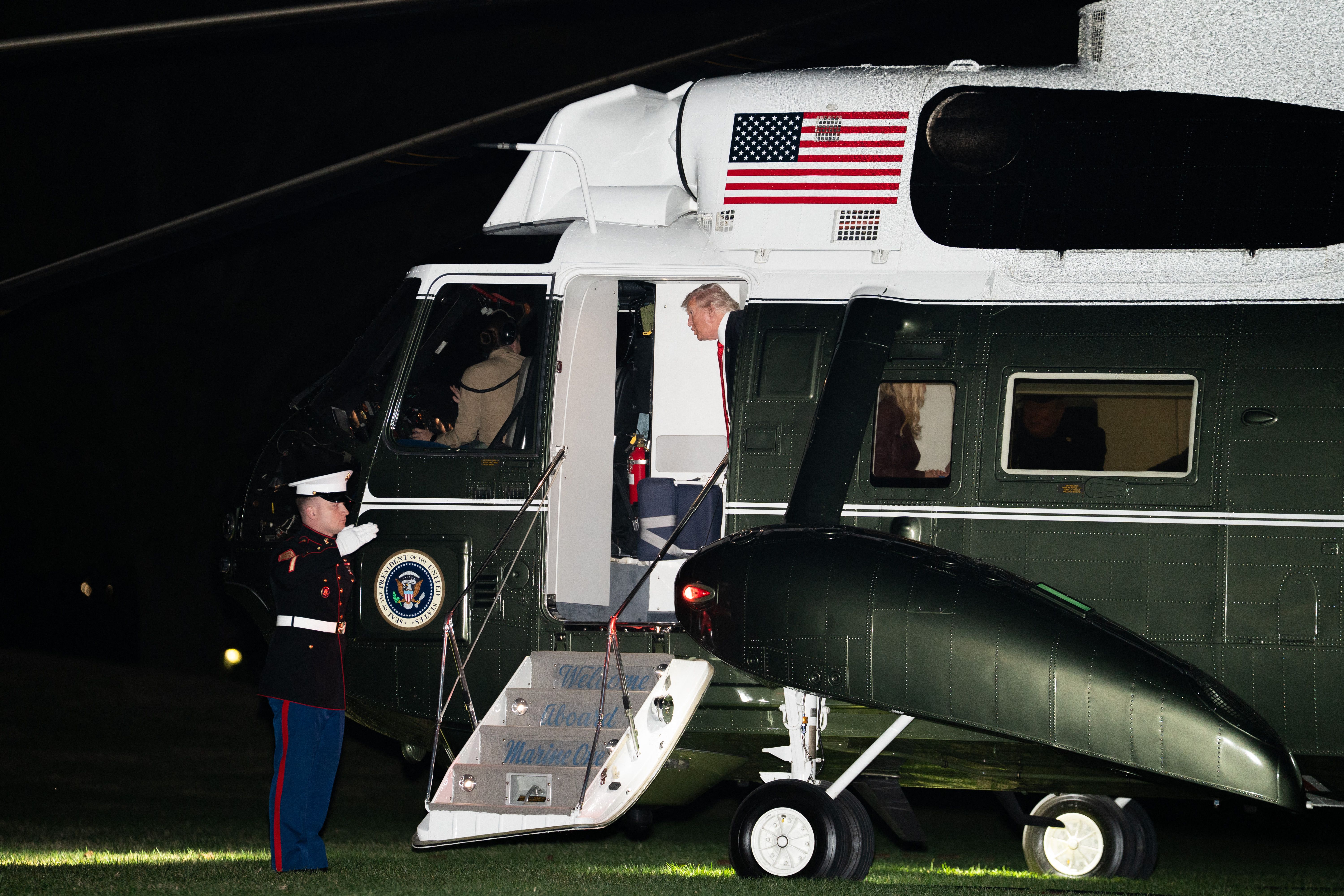 President Trump talks to the pilots of Marine One after landing on the South Lawn last night at the end of a weekend trip to Mar-a-Lago.