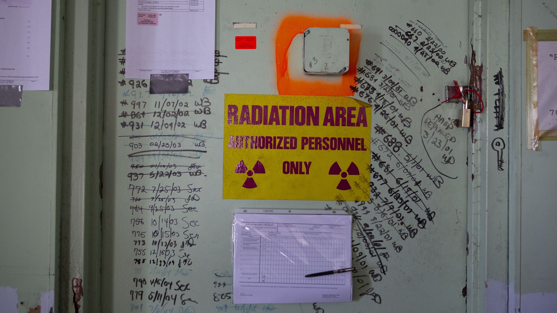 A red on yellow radiation warning sign on a former nuclear power plant at Fort Belvoir, Va.