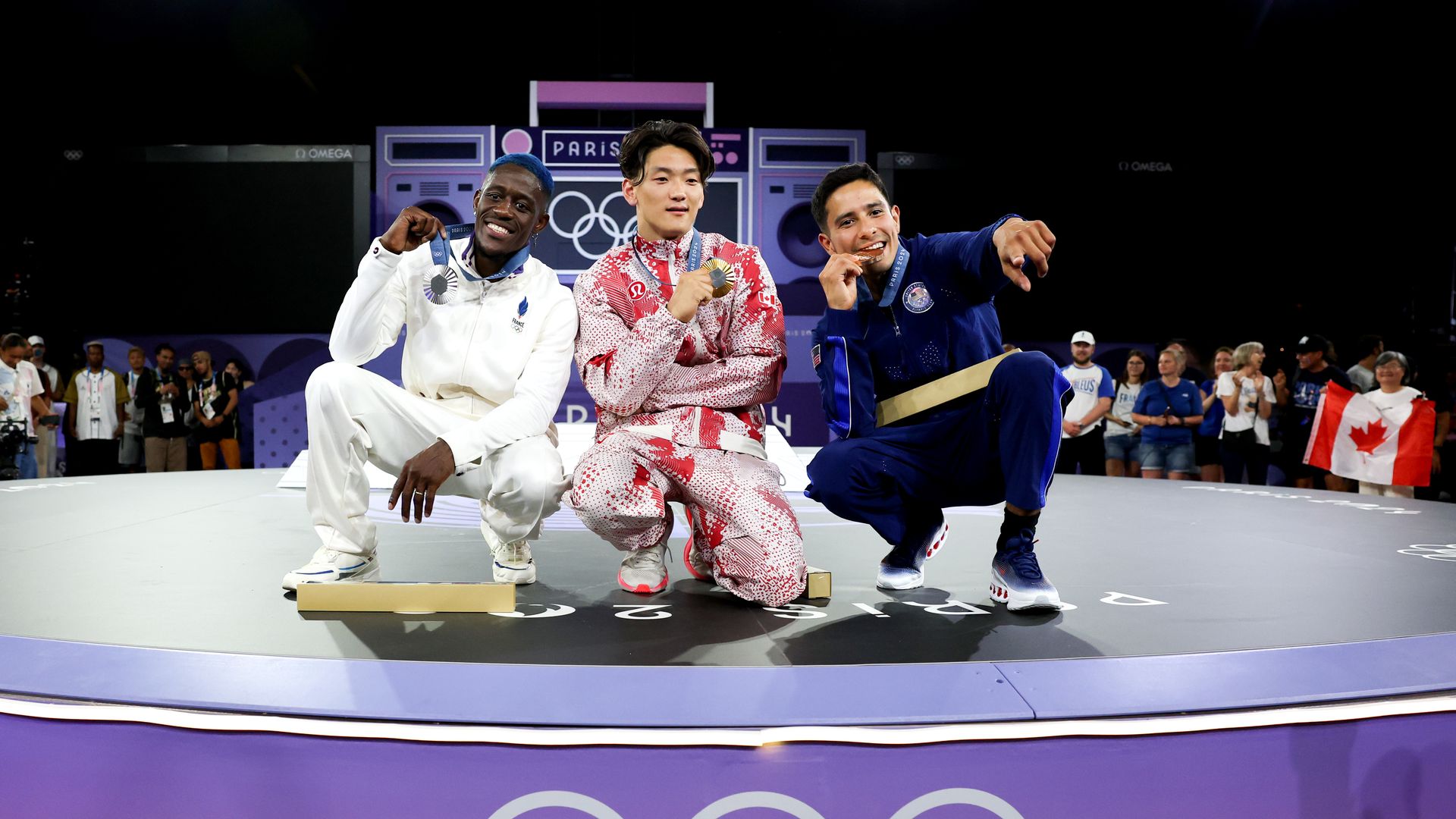  Gold medallist B-Boy Phil Wizard of Team Canada (C), Silver medalist B-Boy Dany Dann of Team France (L) and Bronze medalist B-Boy Victor of Team United States (R) pose during the Breaking B-Boys medal ceremony after the Breaking B-Boys Battles on day fifteen of the Olympic Games Paris 2024 at Place