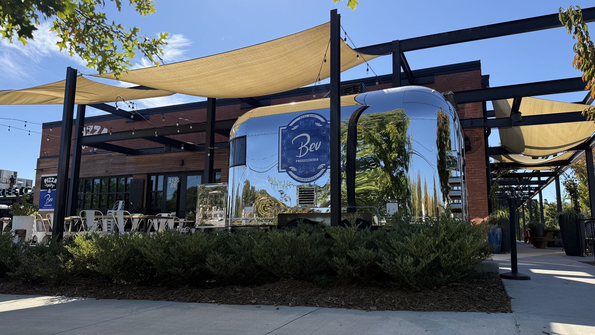 Bev Proseccheria's second location is parked on the patio of Pizza Baby West. Photo: McKenzie Rankin/Axios