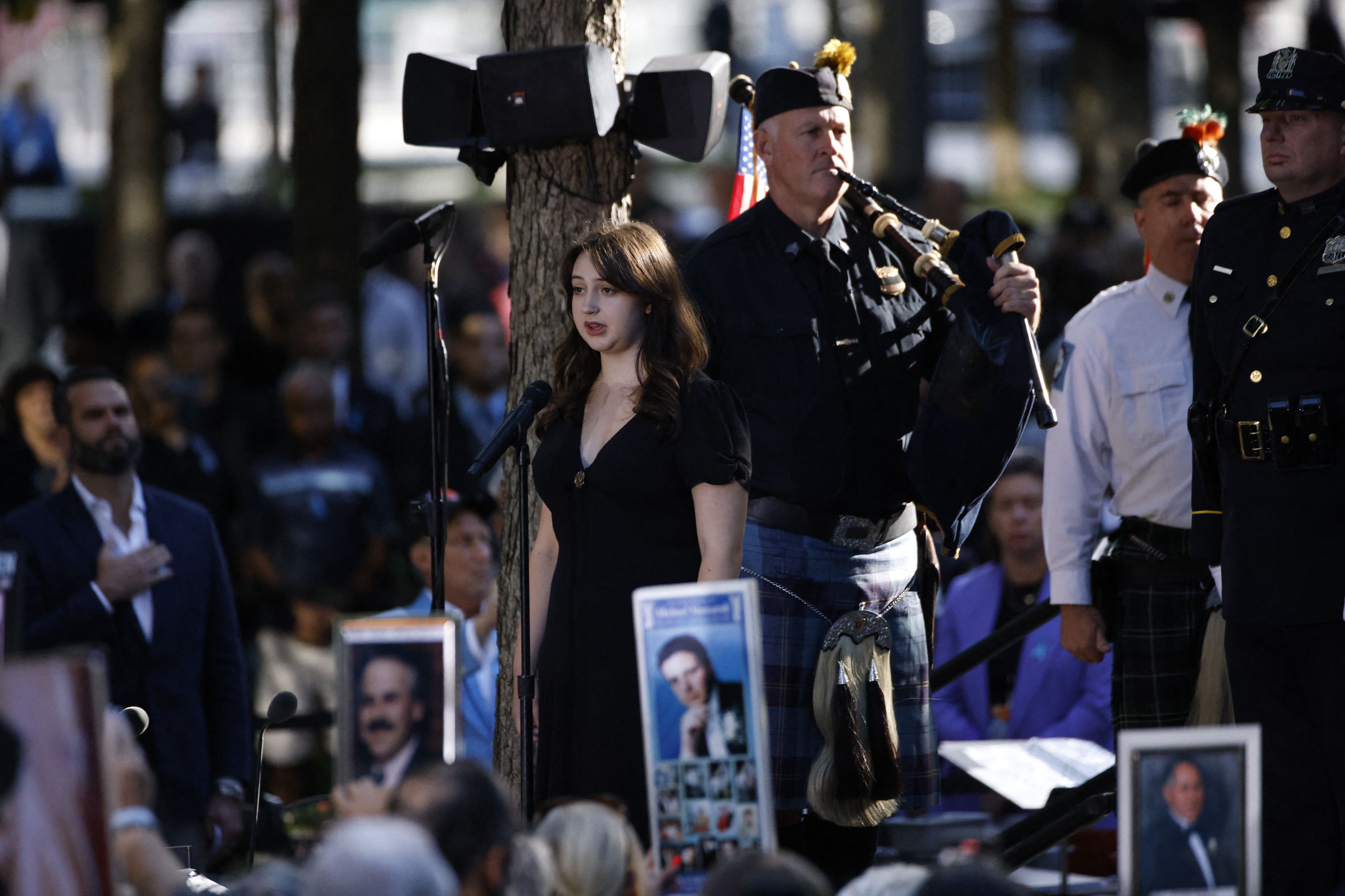 The names of the victims of the 9/11 terror attack are read during a remembrance ceremony on the 23rd anniversary of the September 11 terror attack on the World Trade Center at Ground Zero, in New York City on September 11,