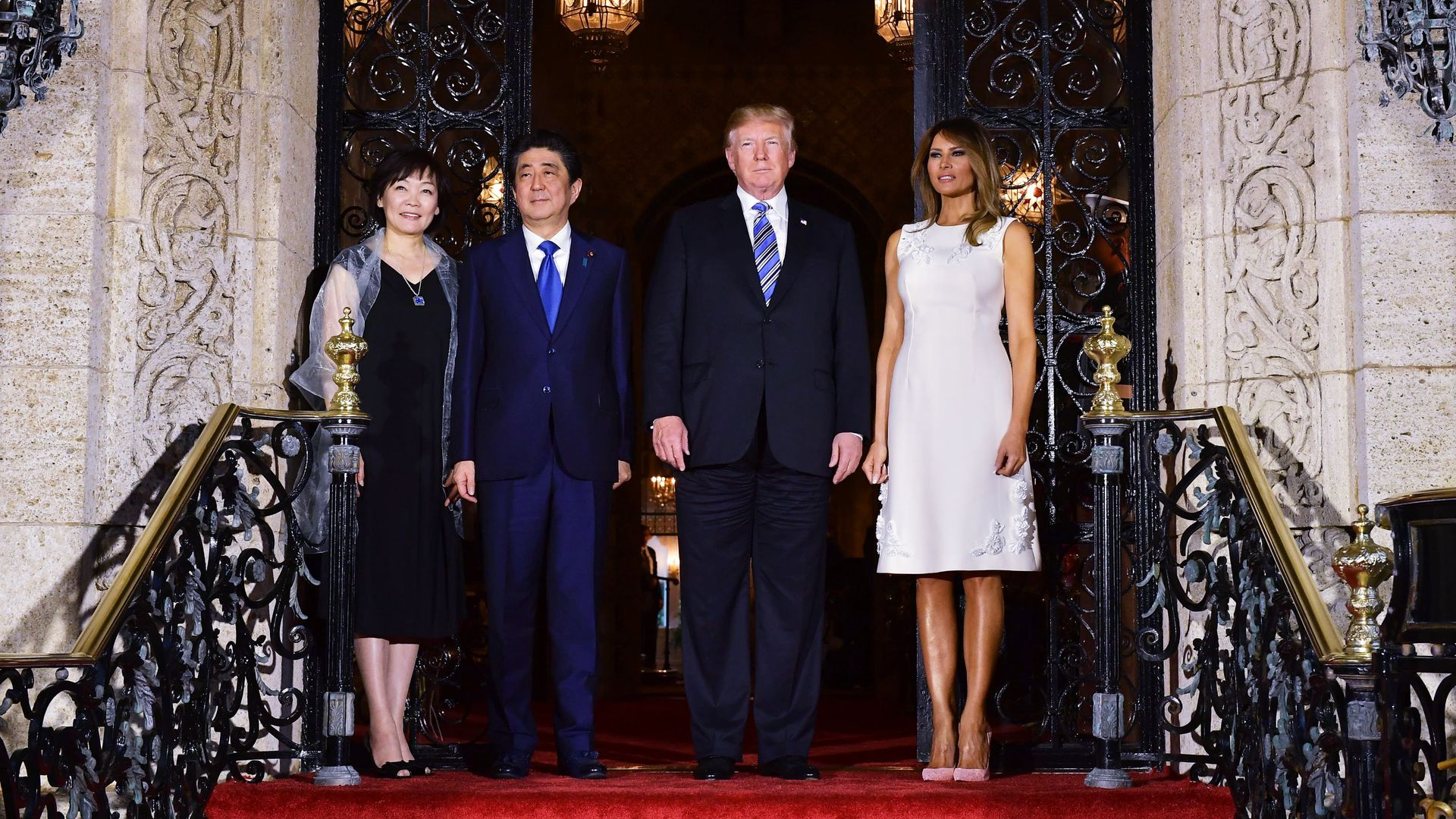 Donald Trump and Shnizo Abe on top of steps