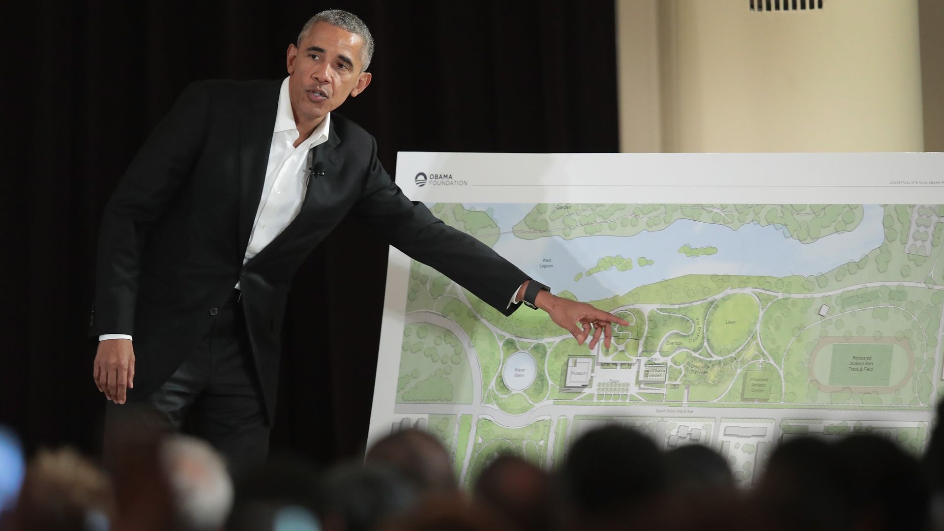 Former President Obama points out features of the proposed Obama Presidential Center during a gathering at the South Shore Cultural Center on May 3, 2017.