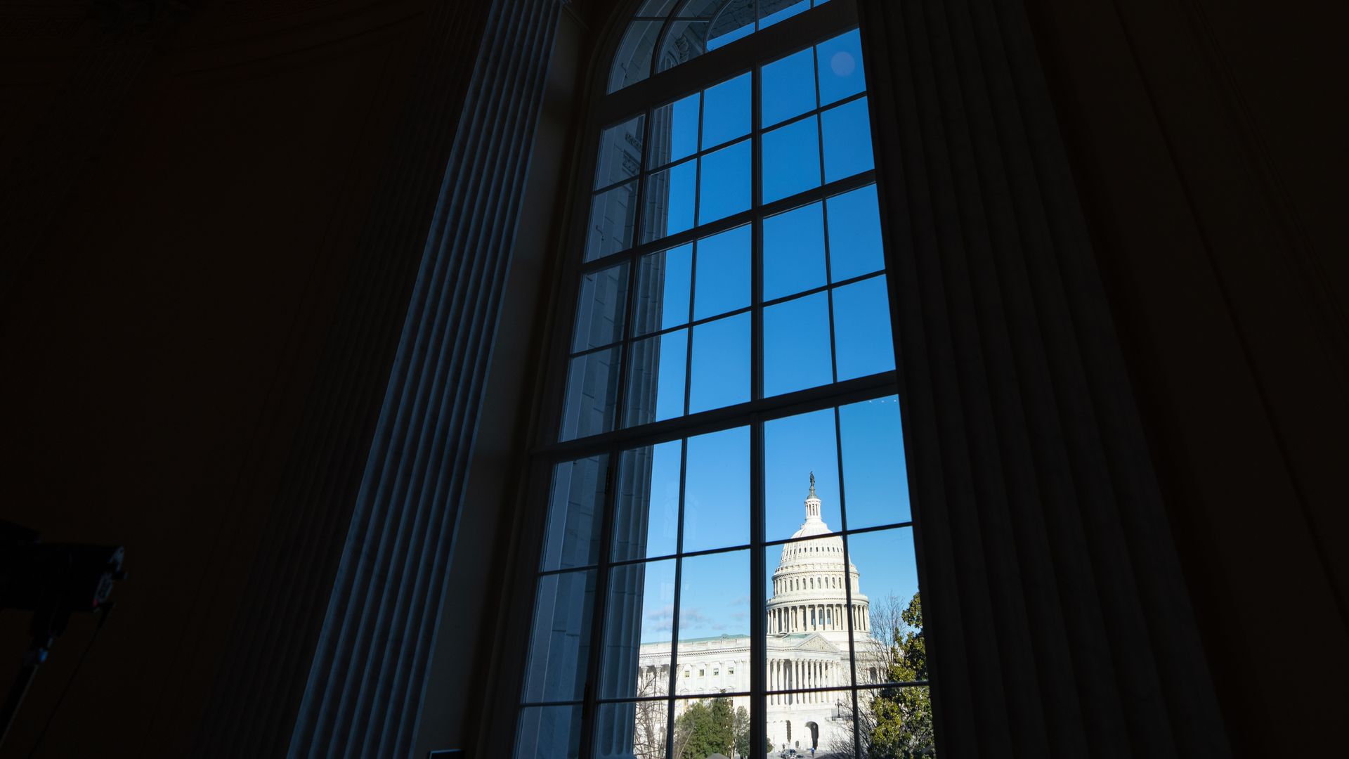 A photograph of the Capitol building from a building nearby