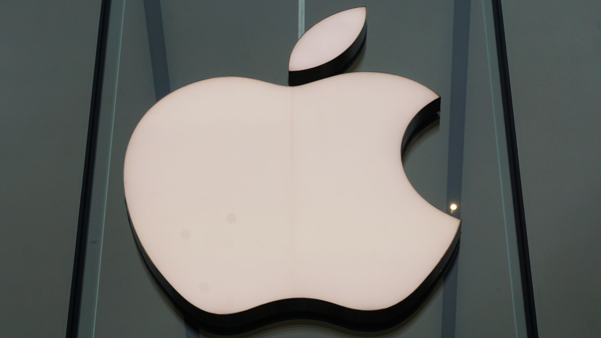The Apple logo on a building.