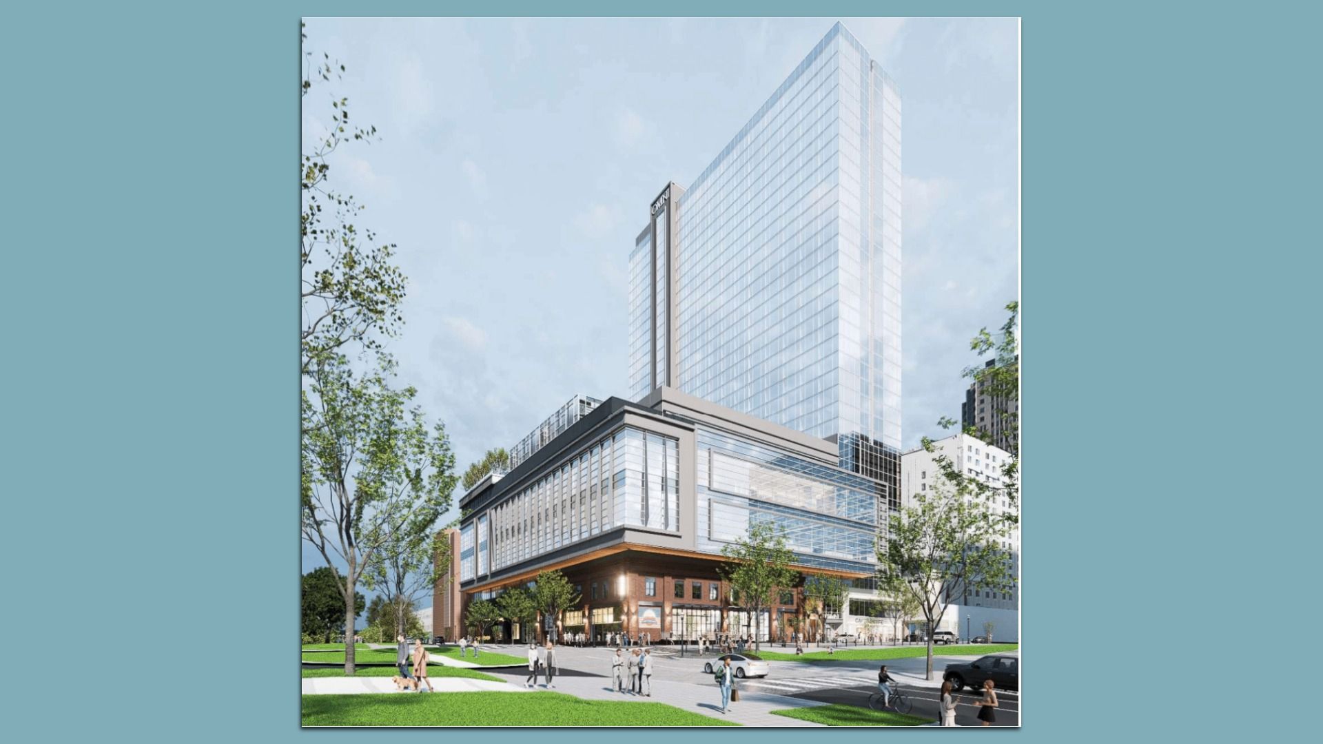 A sleek glass skyscraper rises behind a brick, multi-level podium; in the foreground are trees, people walking, and a green lawn under a bright blue sky.