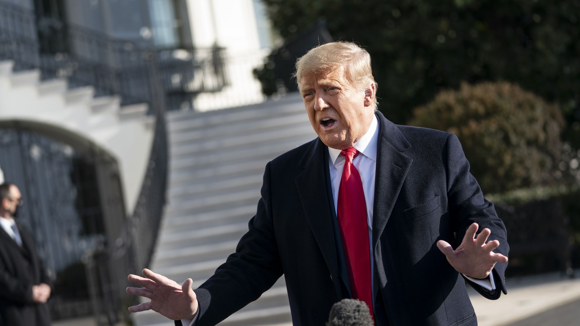 President Donald Trump speaks to reporters on the South Lawn of the White House before boarding Marine One on January 12, 2021 in Washington, DC