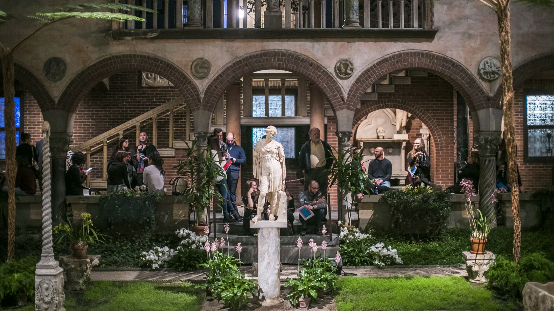 People check out the Gardner Museum, including its central courtyard and its sculptures, during Third Thursdays in 2019.