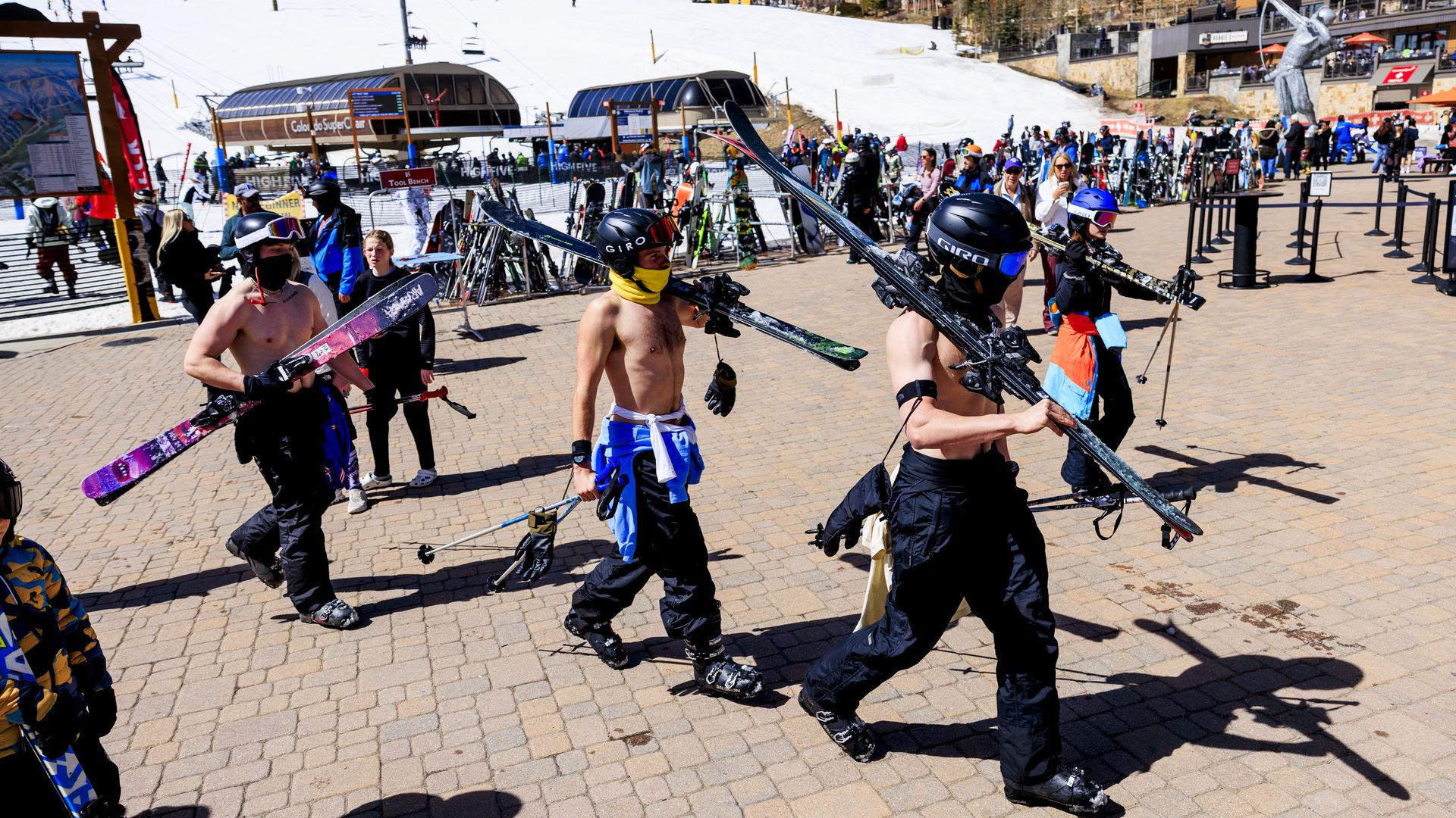 A group of friends finish their last ski run without their shirts on at Breckenridge Ski Resort on March 18, 2026. Photo: Michael Ciaglo/Getty Images
