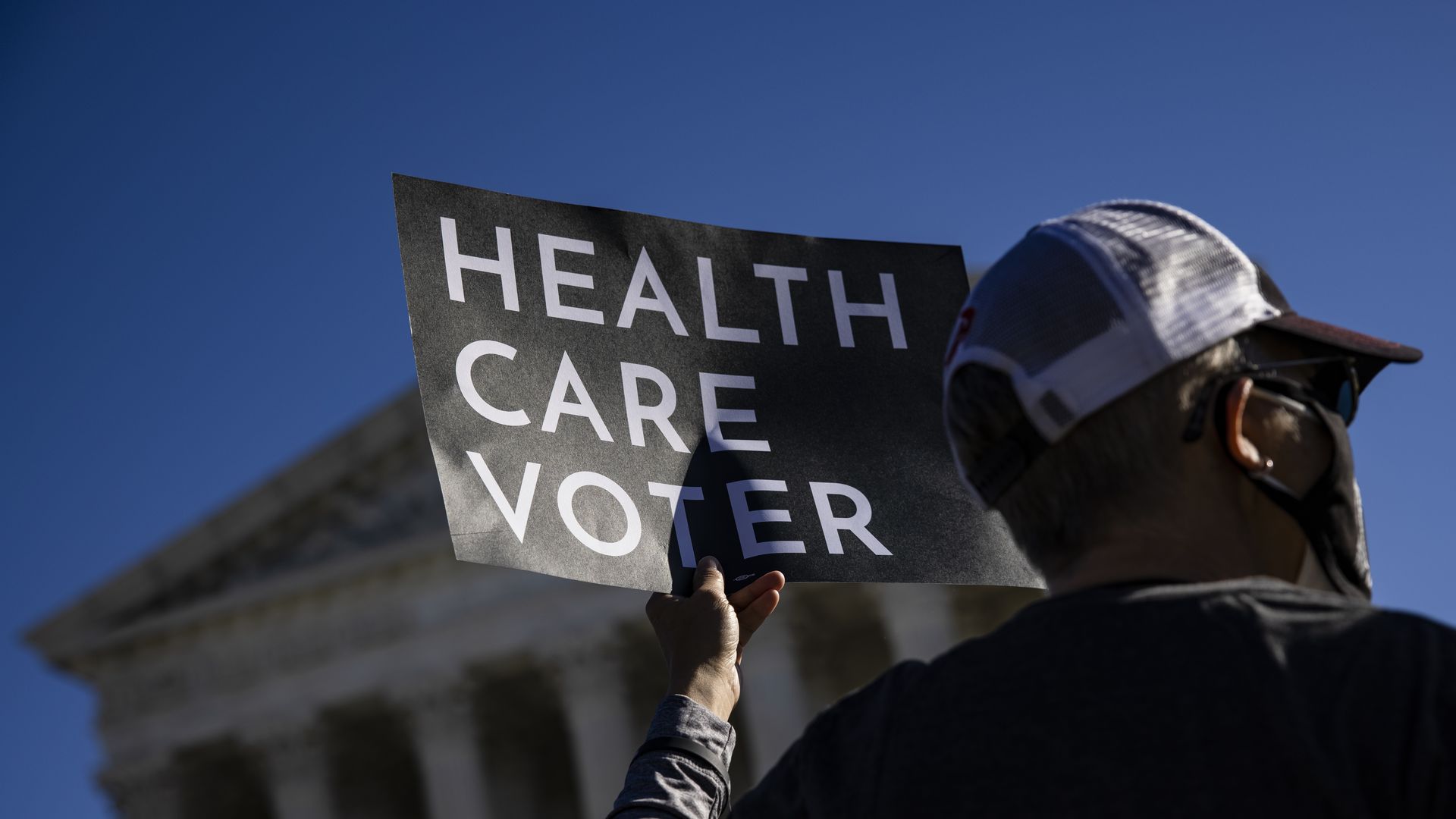 Picture of a sign that says "health care voter"