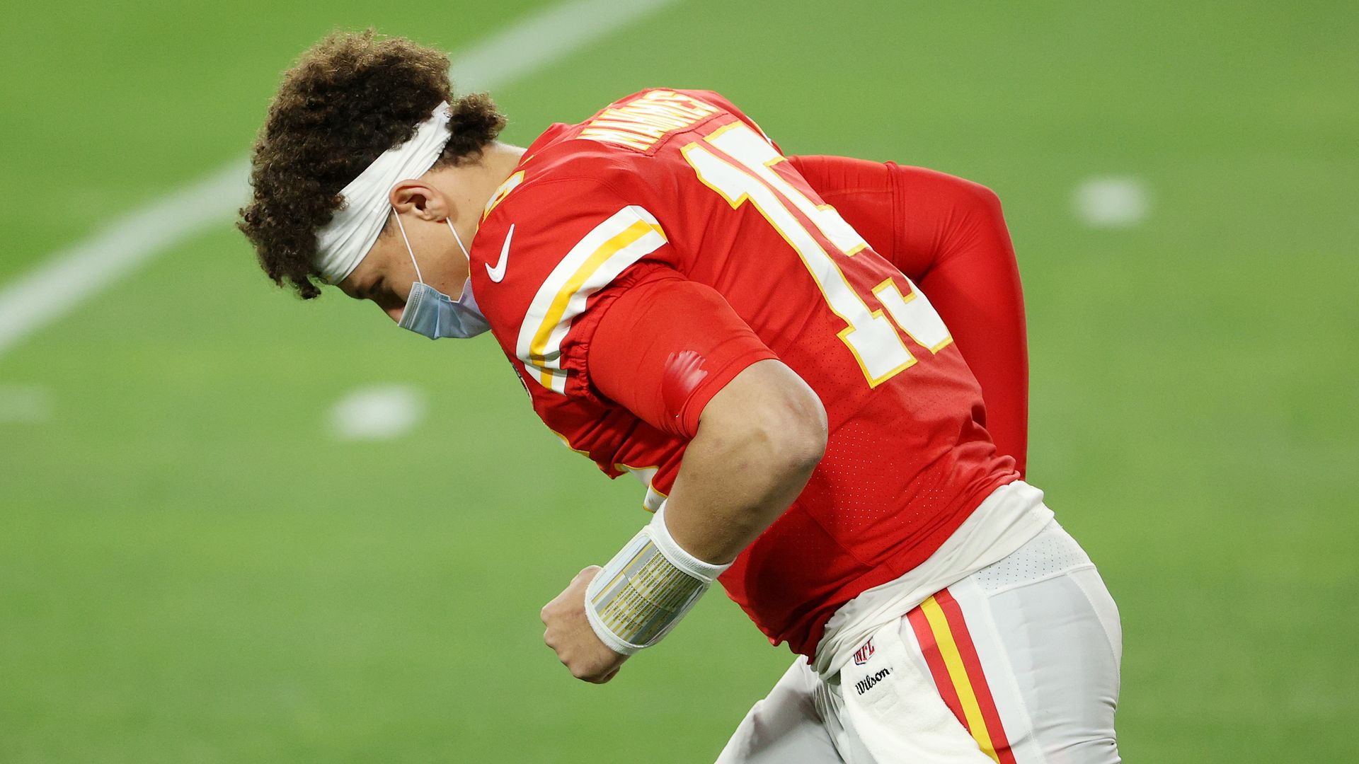 Patrick Mahomes #15 of the Kansas City Chiefs wears a facemask while preparing for the start of Super Bowl LV against the Tampa Bay Buccaneers 