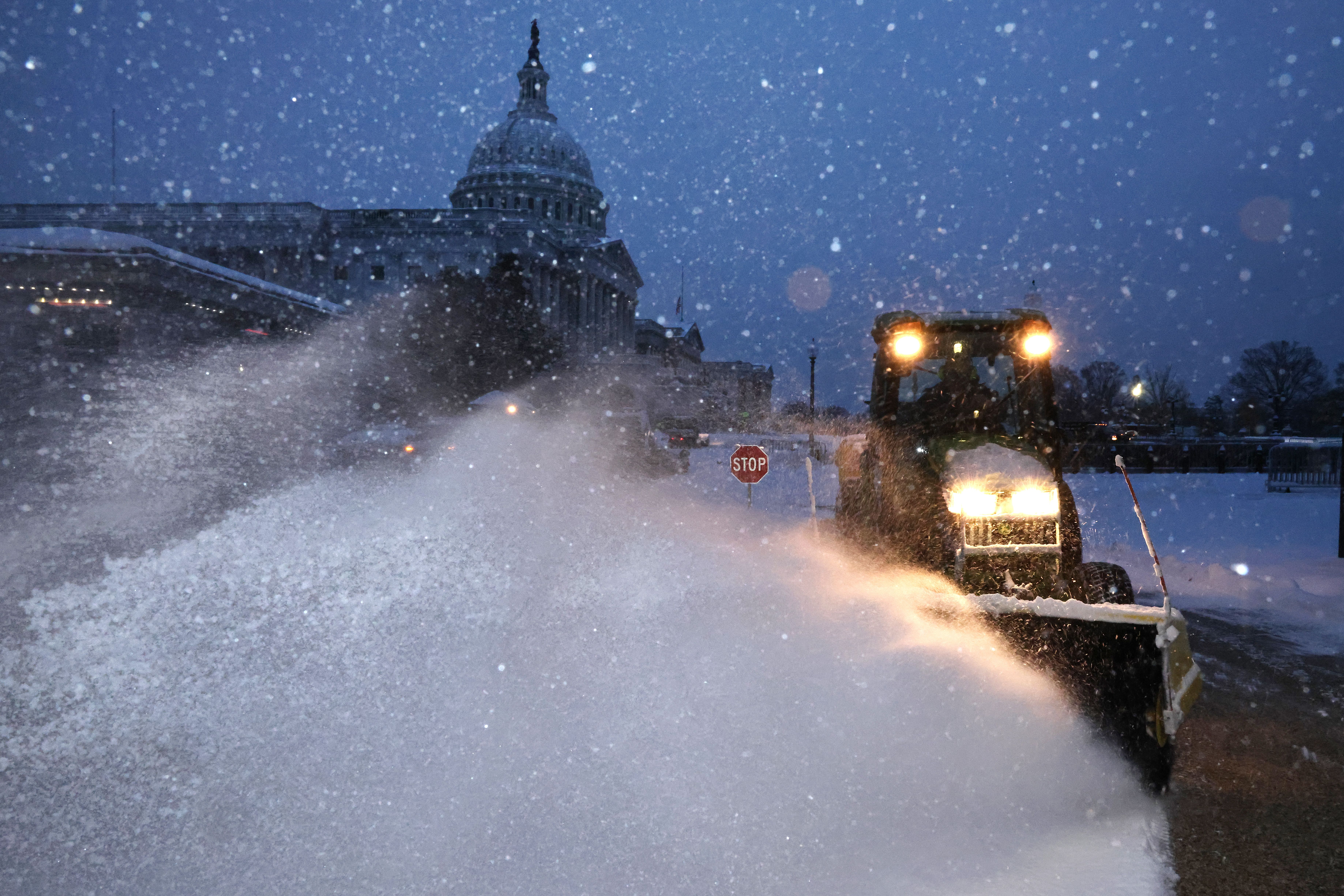 Crews clear snow at the U.S. Capitol
