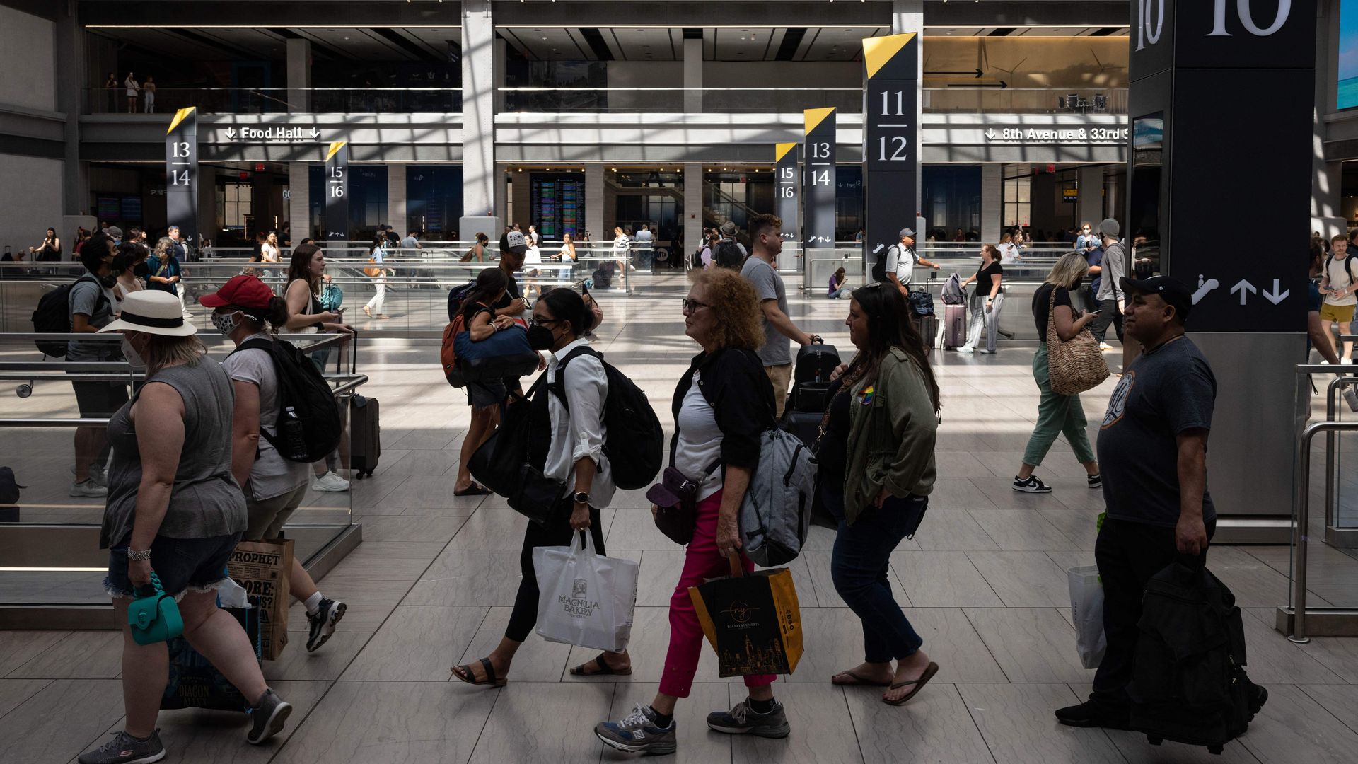 Travelers move through the Moynihan Train Hall as Labor Day weekend kicks off, one of the busiest travel periods of the year, in New York on September 2, 2022.