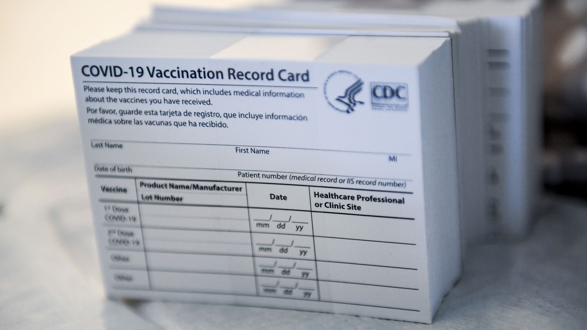 A stack of COVID-19 Vaccination Record Cards from the CDC