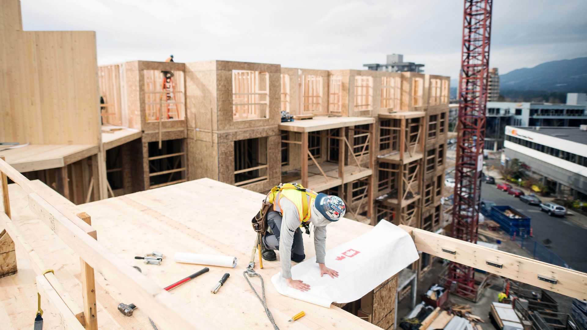 A worker at a mass-timber construction site in North Vancouver, British Columbia, Canada. 