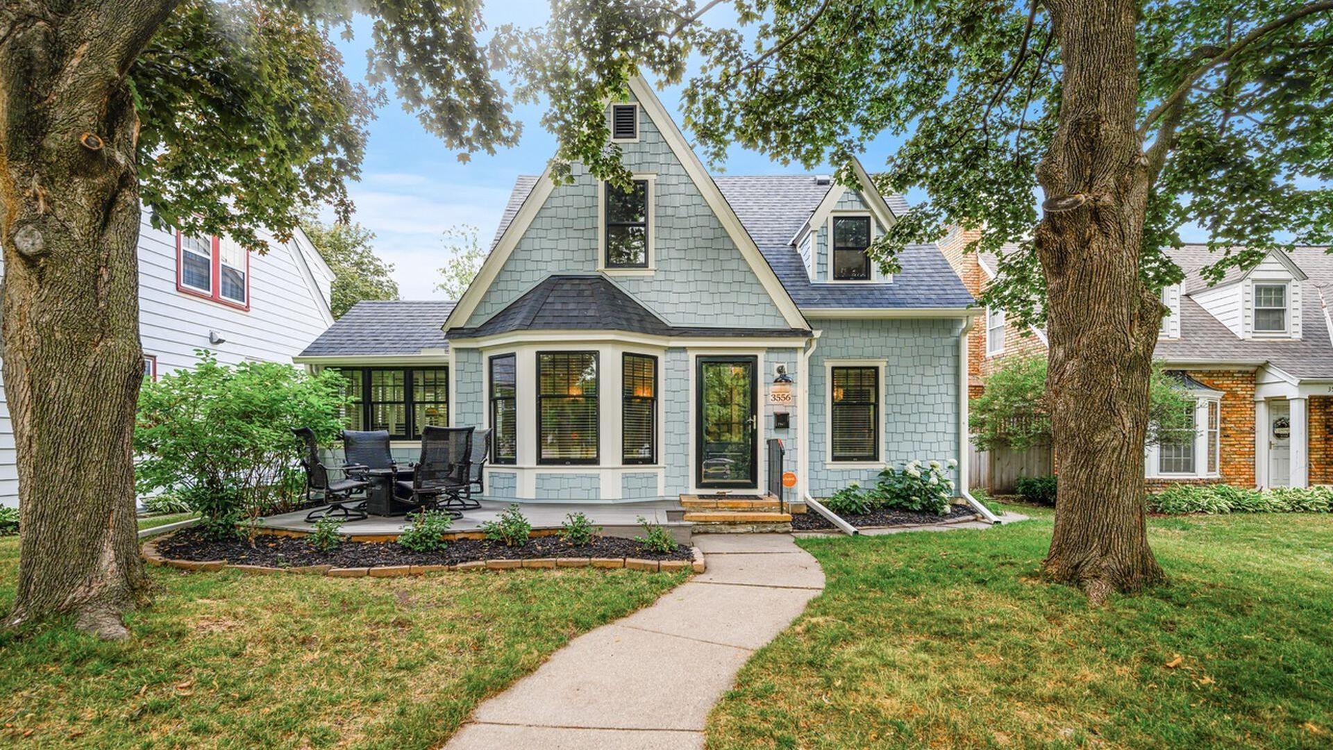 exterior view of blue house with front porch