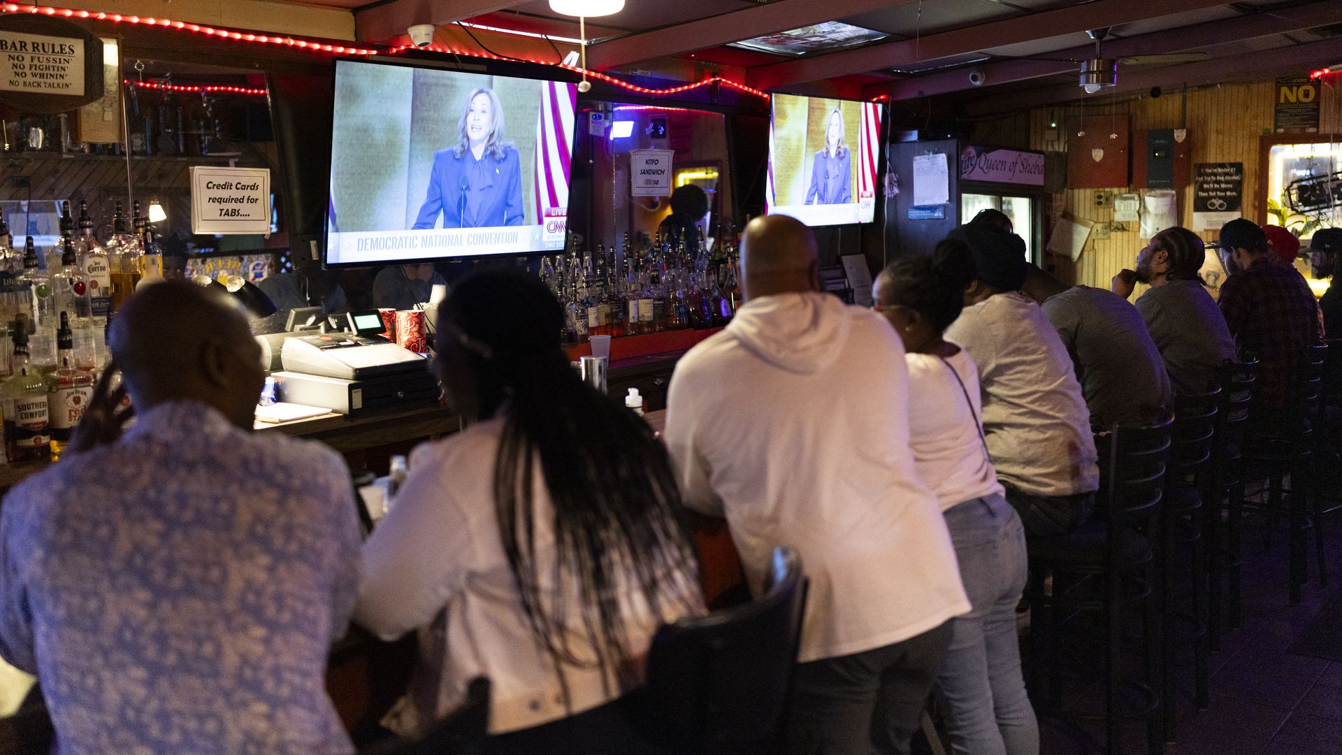 People the Queen of Sheba restaurant and bar watching Democratic presidential candidate Kamala Harris deliver her acceptance speech.
