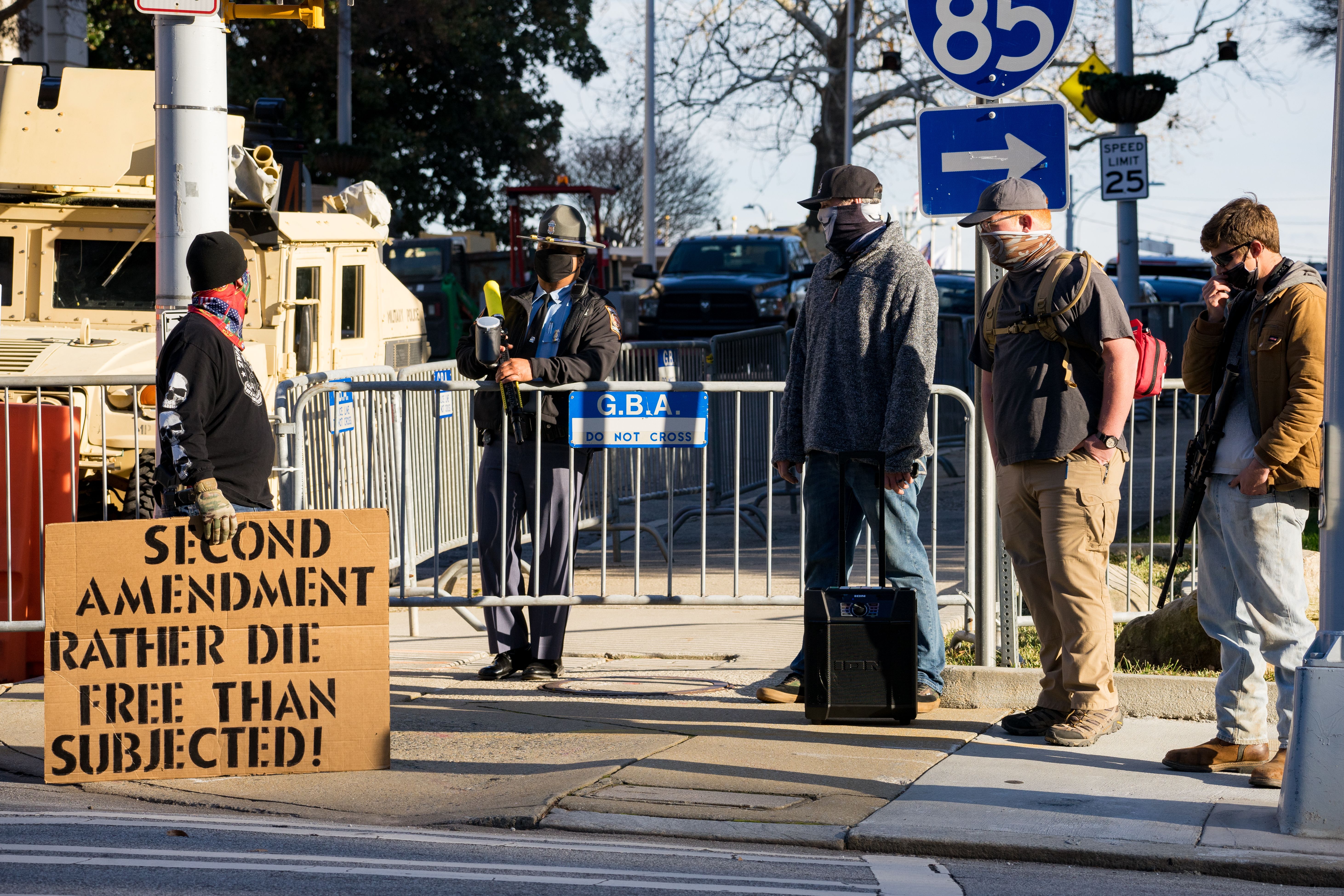 Supporters of the second amendment stand outside of the Georgia Capitol building on January 17