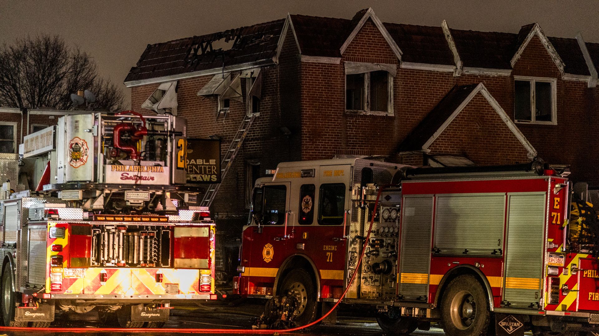 A view of the roof of a home struck by a small plane that crashed into a residential area in Philadelphia. 