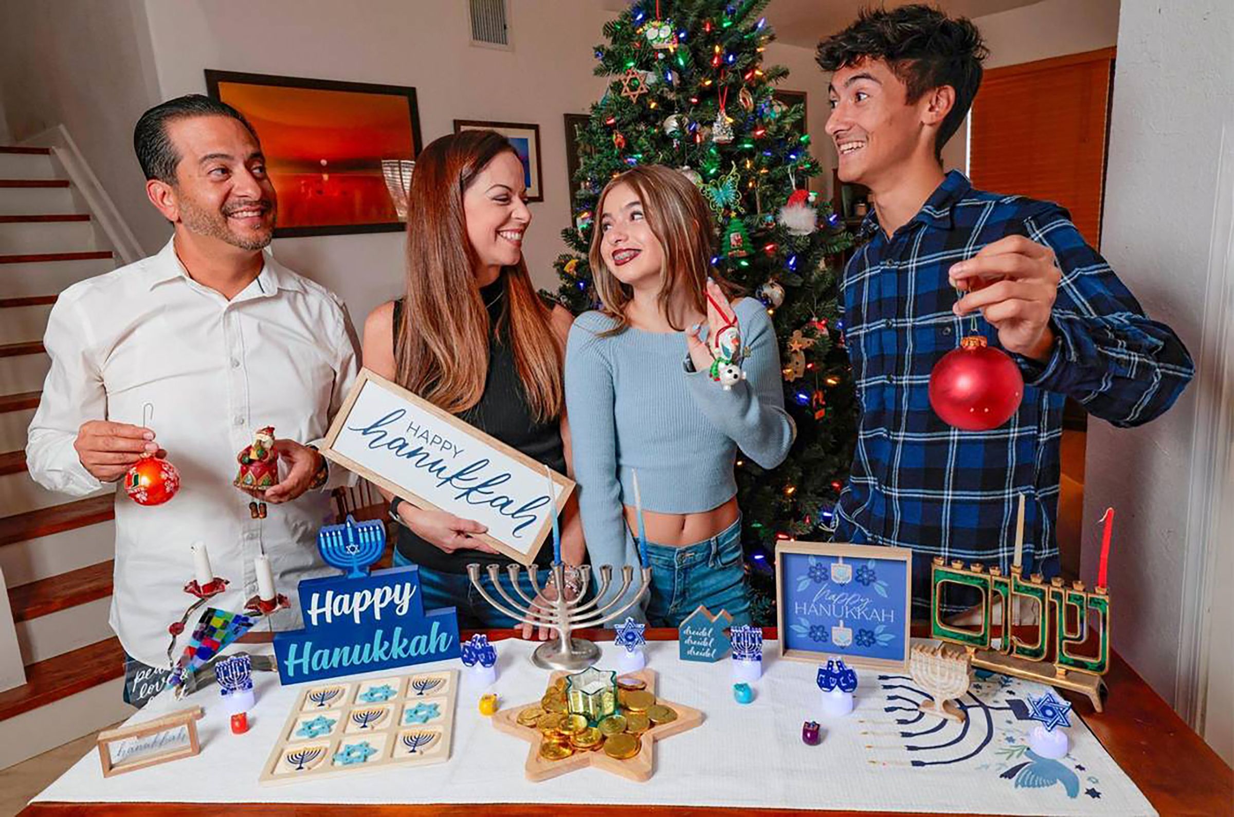 Frank Robleto Jr. and Sarah Robleto have different religious backgrounds (Frank is Catholic and Sarah is Jewish) so they celebrate both Christmas and Hanukkah with their children, Madelyne Robleto, 13, and Jacob Robleto, 19, at their home in Cutler Bay, Fla.