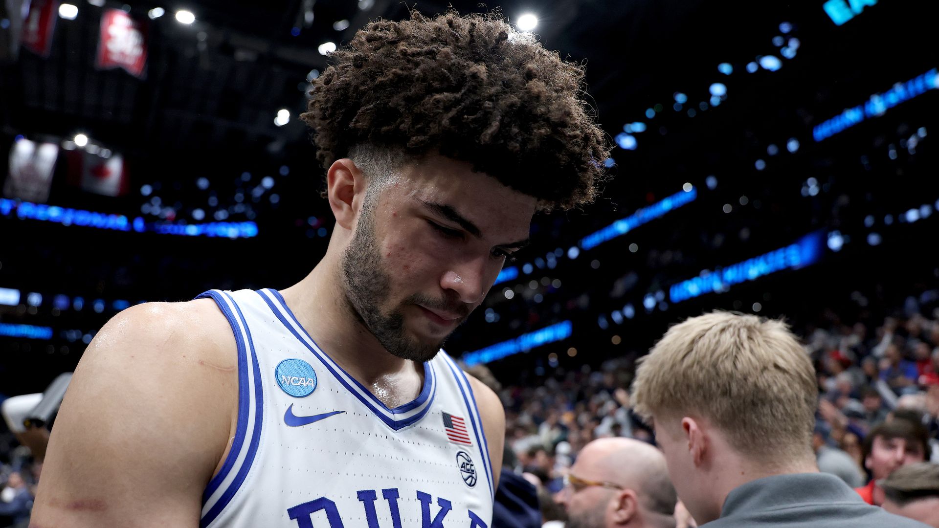 Cameron Boozer #12 of the Duke Blue Devils walks off the court after being defeated by the UConn Huskies 73-72 in the Elite Eight.