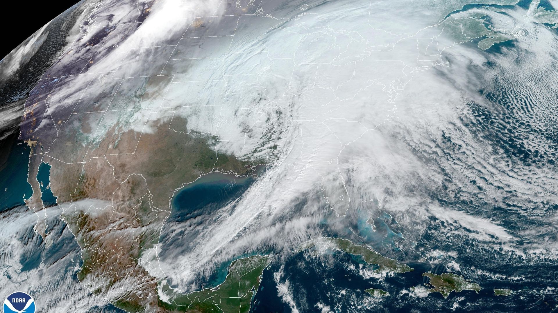A satellite image of a large winter storm covering most of the U.S.