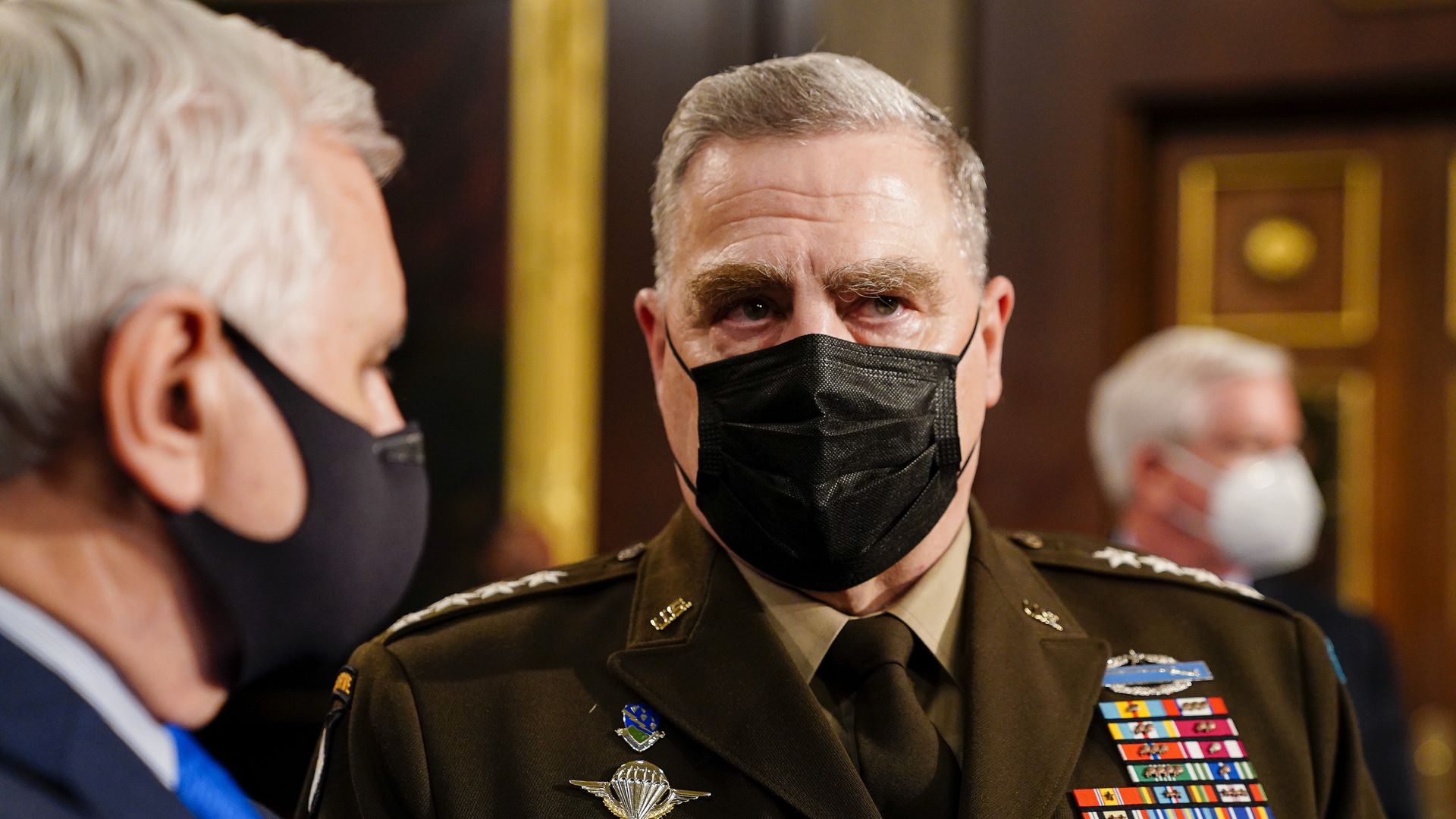 Photo of a masked Mark Milley's face