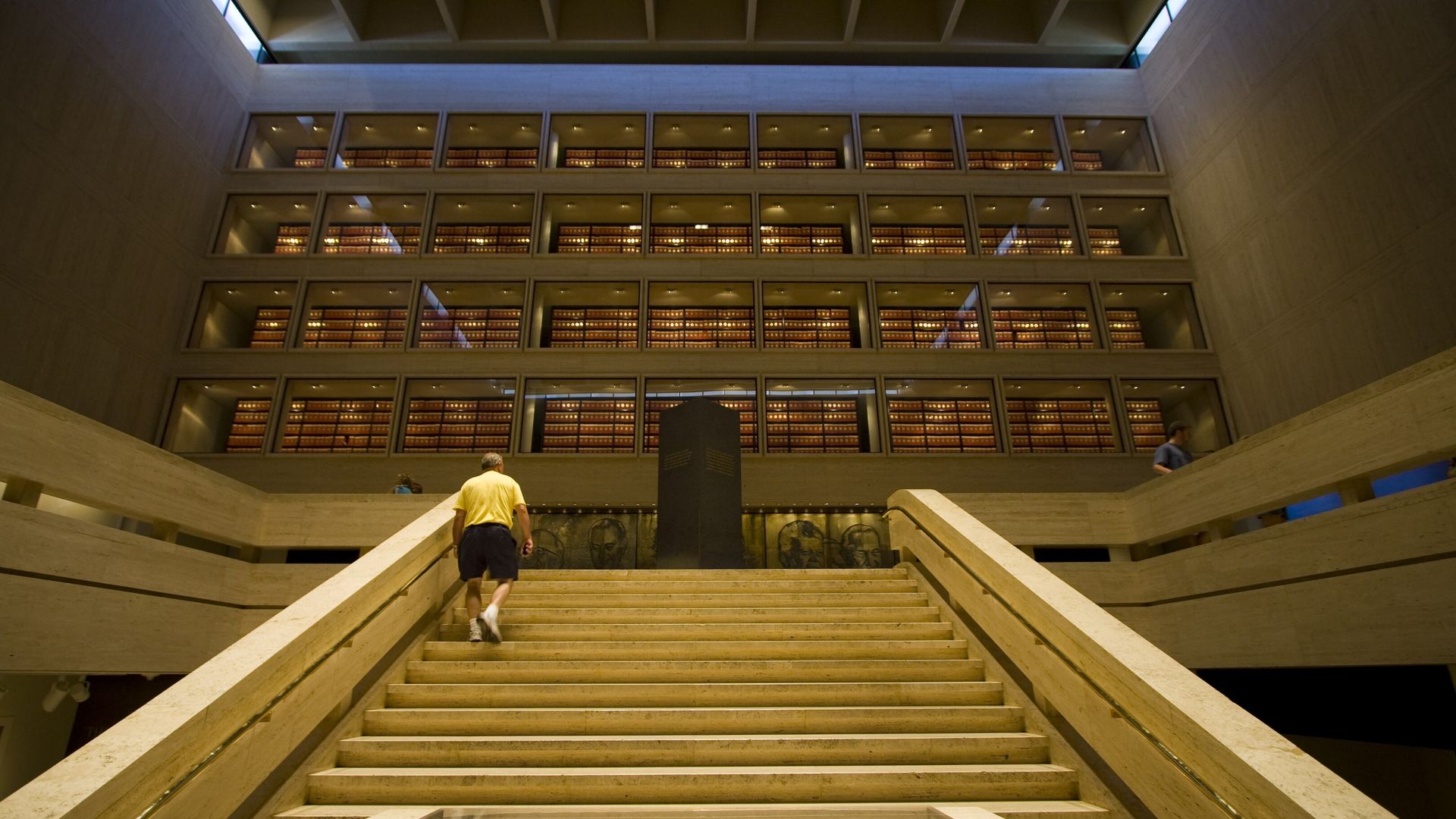 A person ascends a staircase at the LBJ Library.