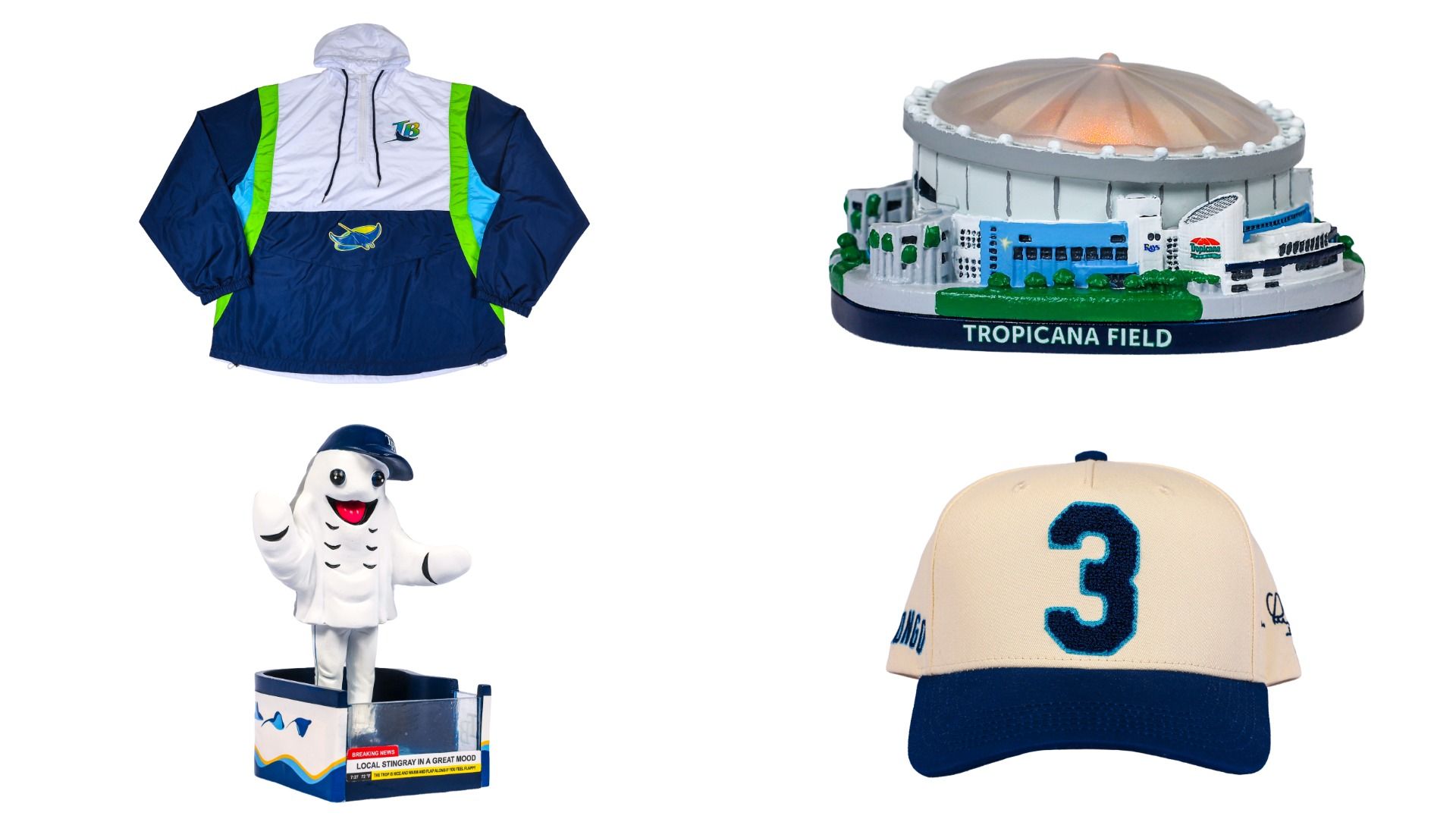 Collection of Tampa Bay Rays memorabilia: navy, white, and green jacket; Tropicana Field model; smiling stingray mascot figurine; cream and navy baseball cap with number 3.