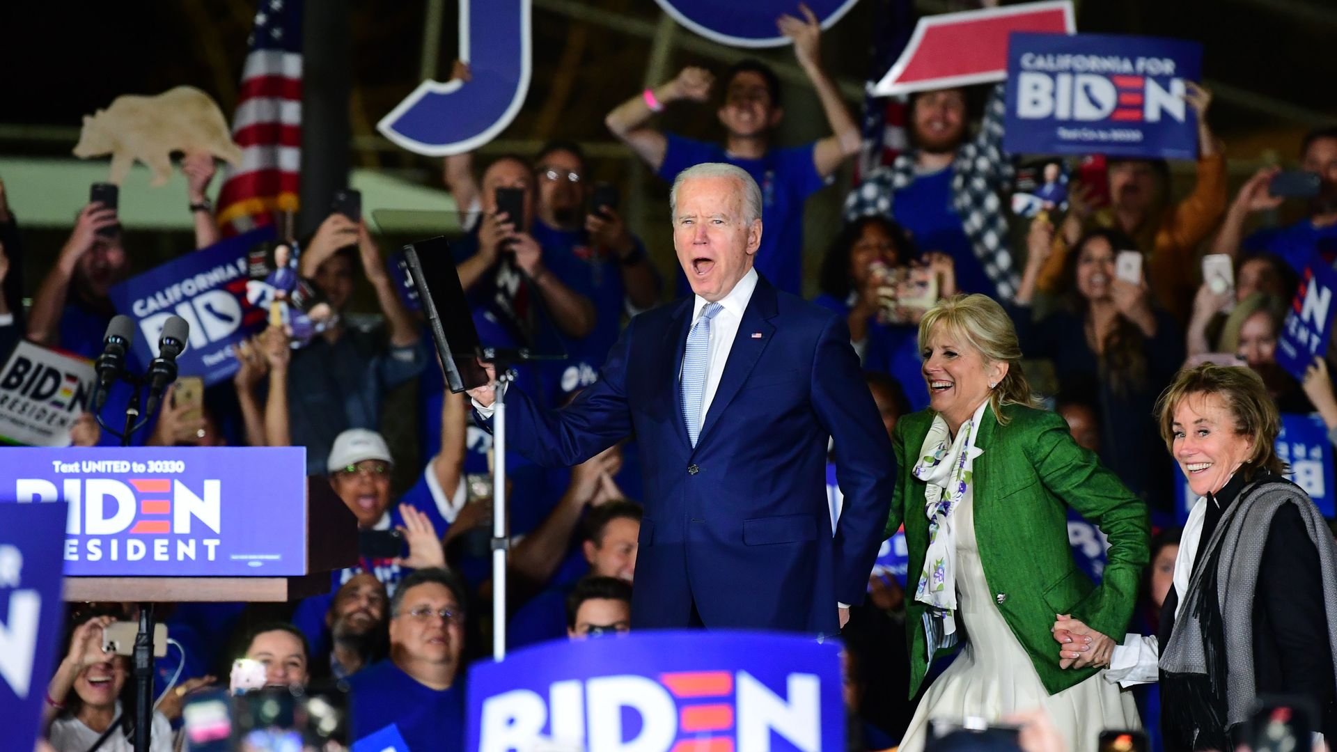 Democratic presidential hopeful former Vice President Joe Biden (L) arrives onstage with his wife Jill and sister Valerie (R) for a Super Tuesday event in Los Angeles on March 3, 2020