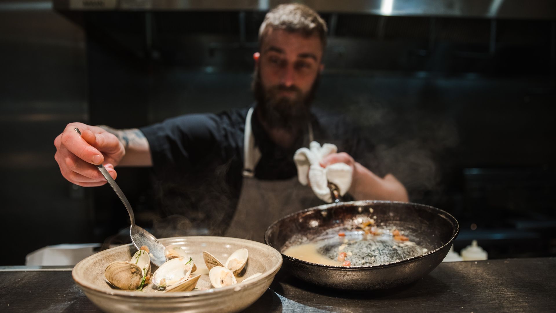 Chef stirs dishes