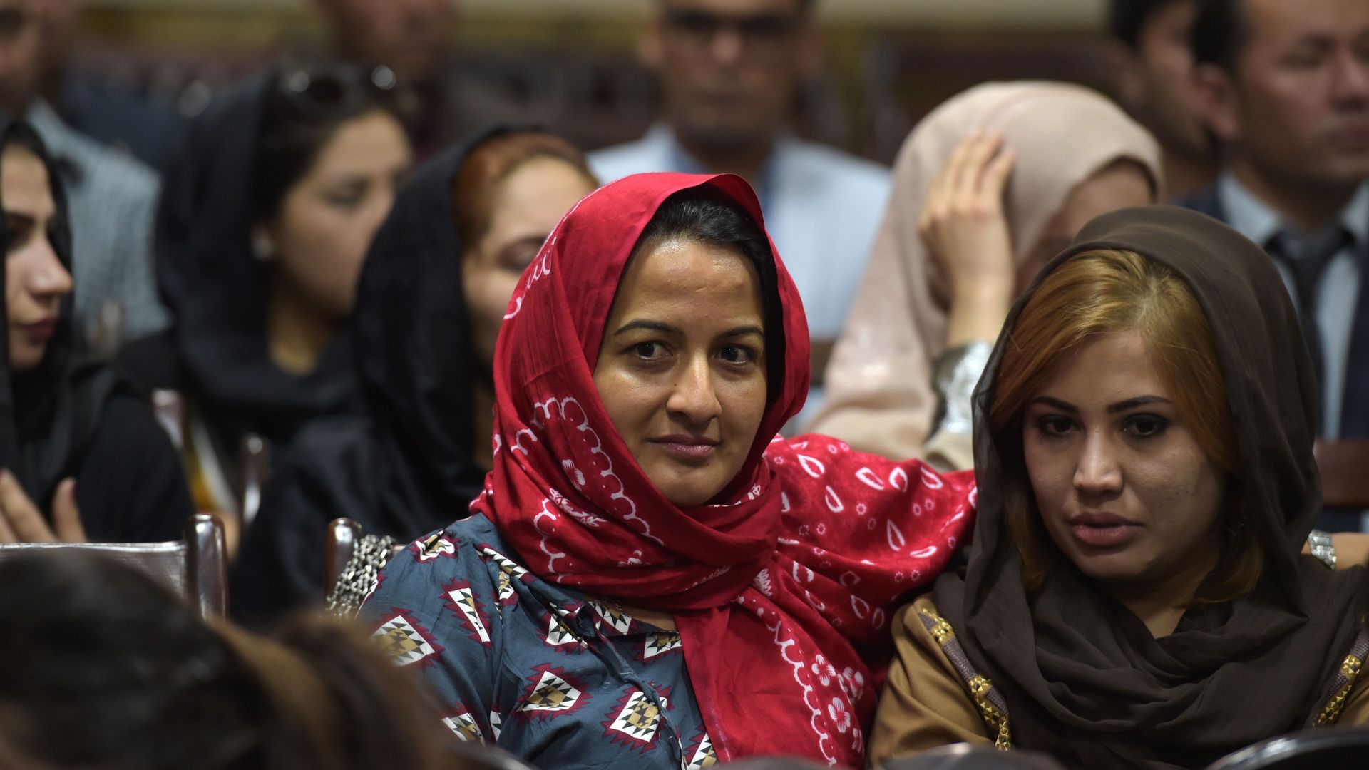 Afghan women sitting together at a meeting.
