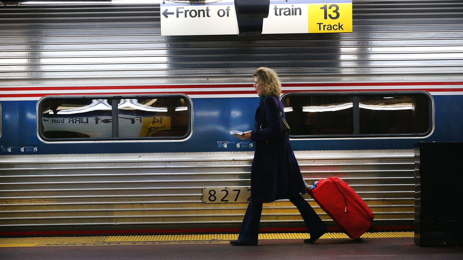 Woman boarding amtrak train