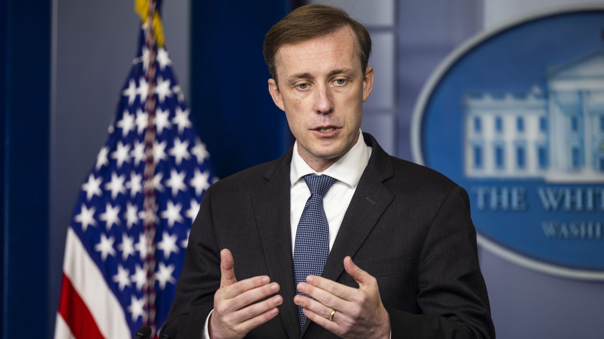 National Security Adviser Jake Sullivan is seen addressing reporters at the White House.