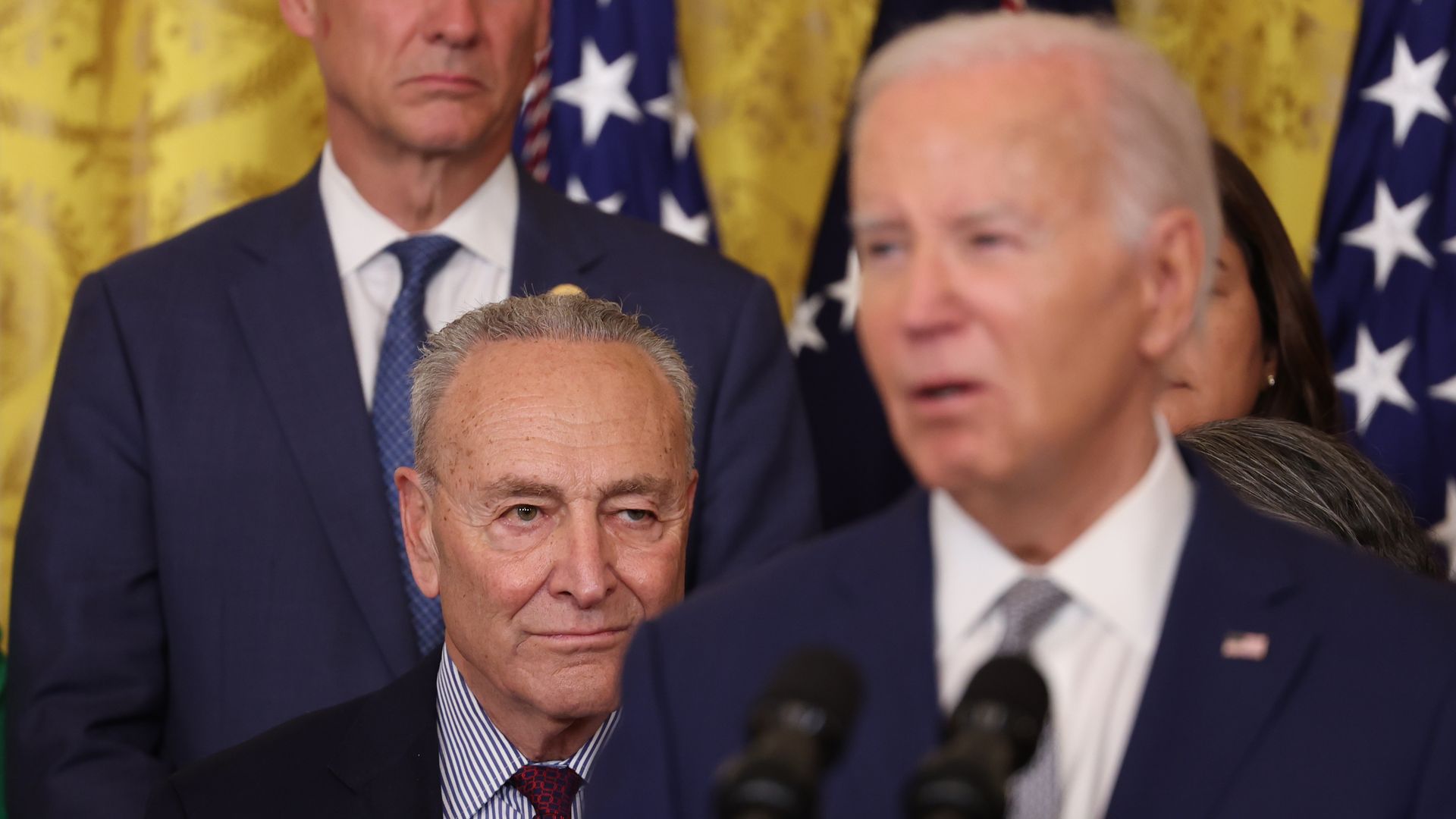 Senate Majority Leader Chuck Schumer, a Democrat from New York, left, as US President Joe Biden speaks in the East Room of the White House in Washington, DC, US, on Tuesday, June 18, 2024.