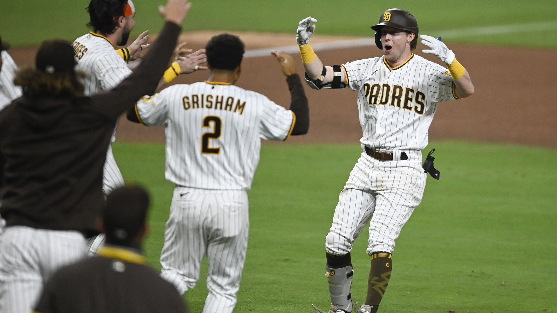 Jake Cronenworth celebrates with teammates