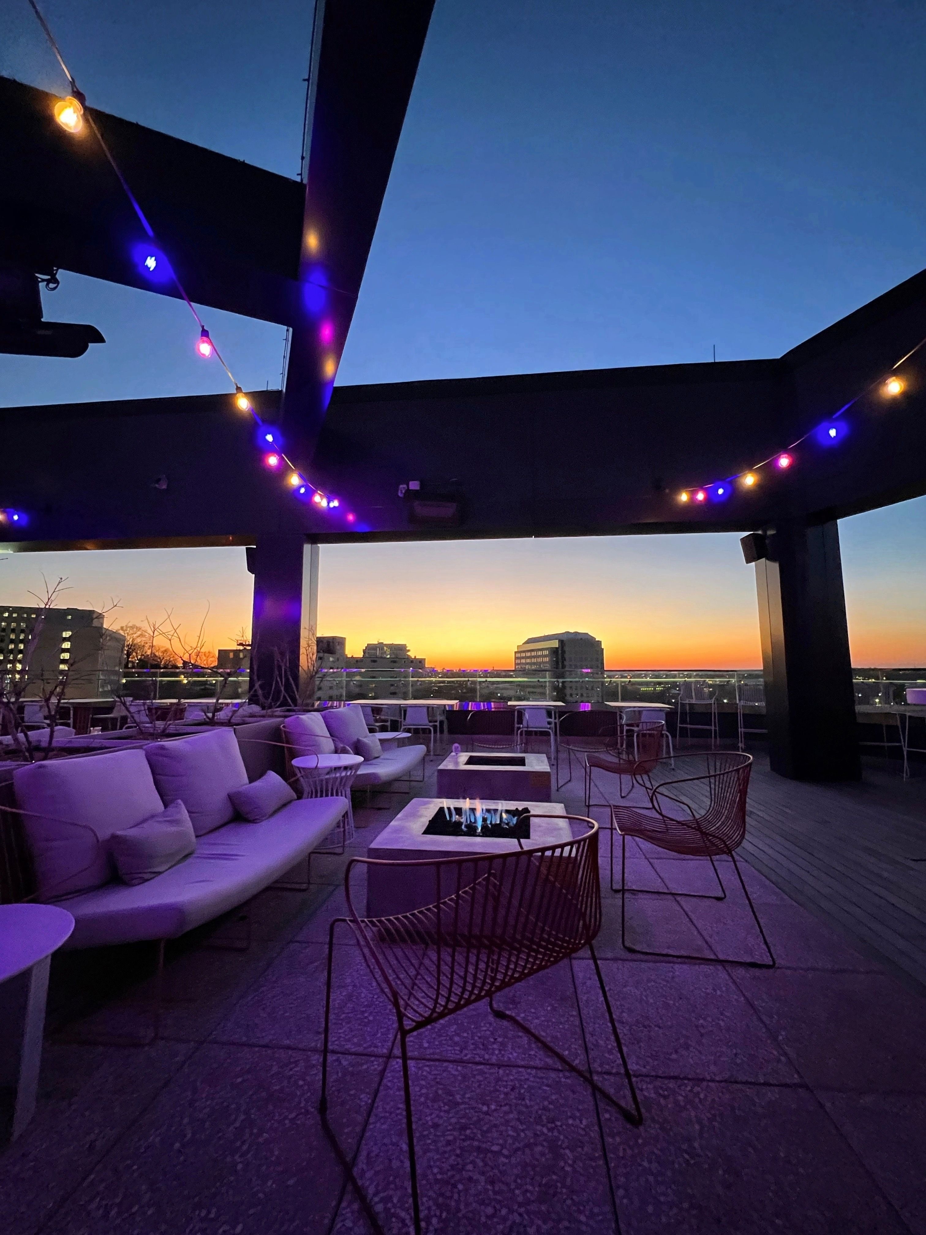 A rooftop bar at sunset