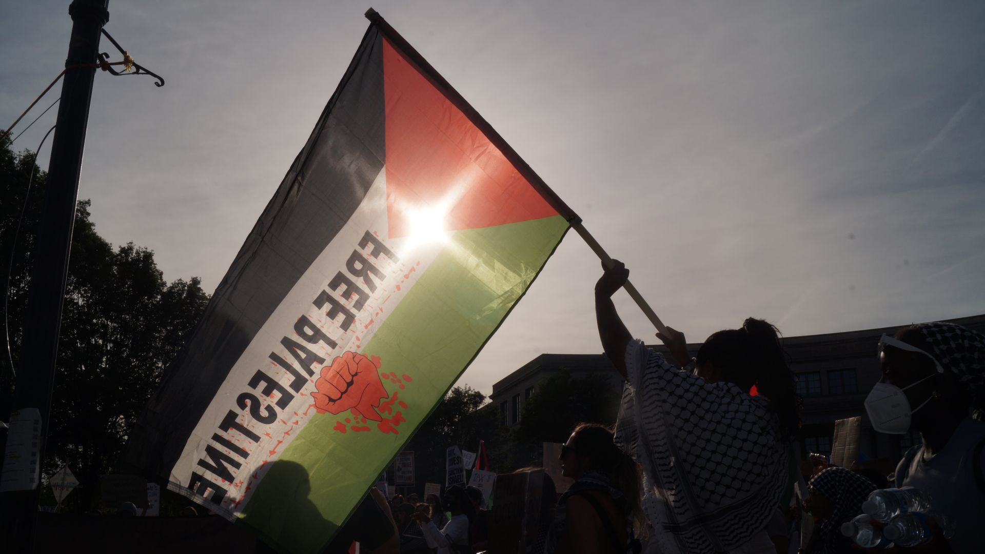 Free Palestine flag waving in twilight sun