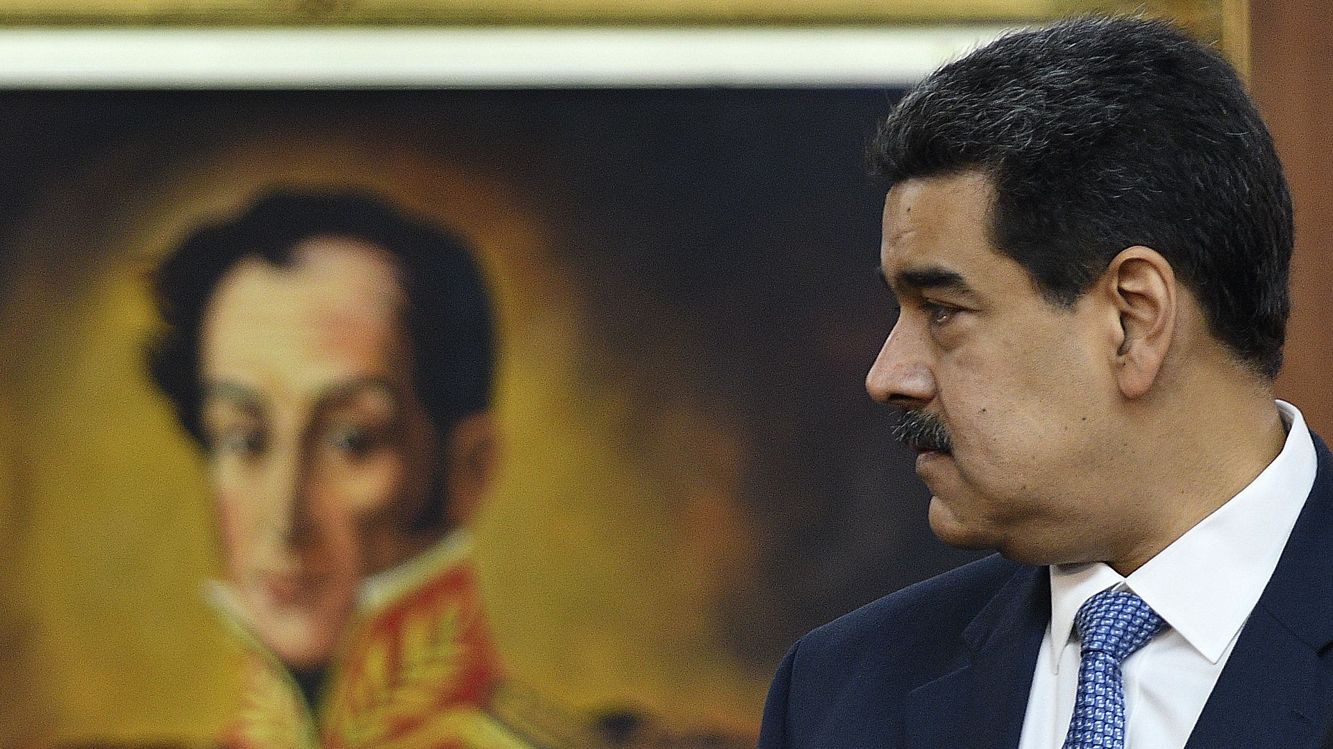 Maduro looking to his right.